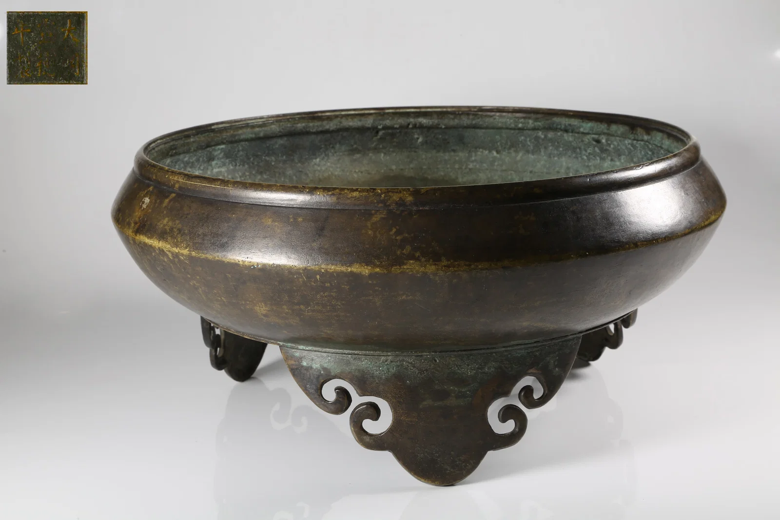 A BRONZE CENSER WITH RUYI-SHAPED FEET