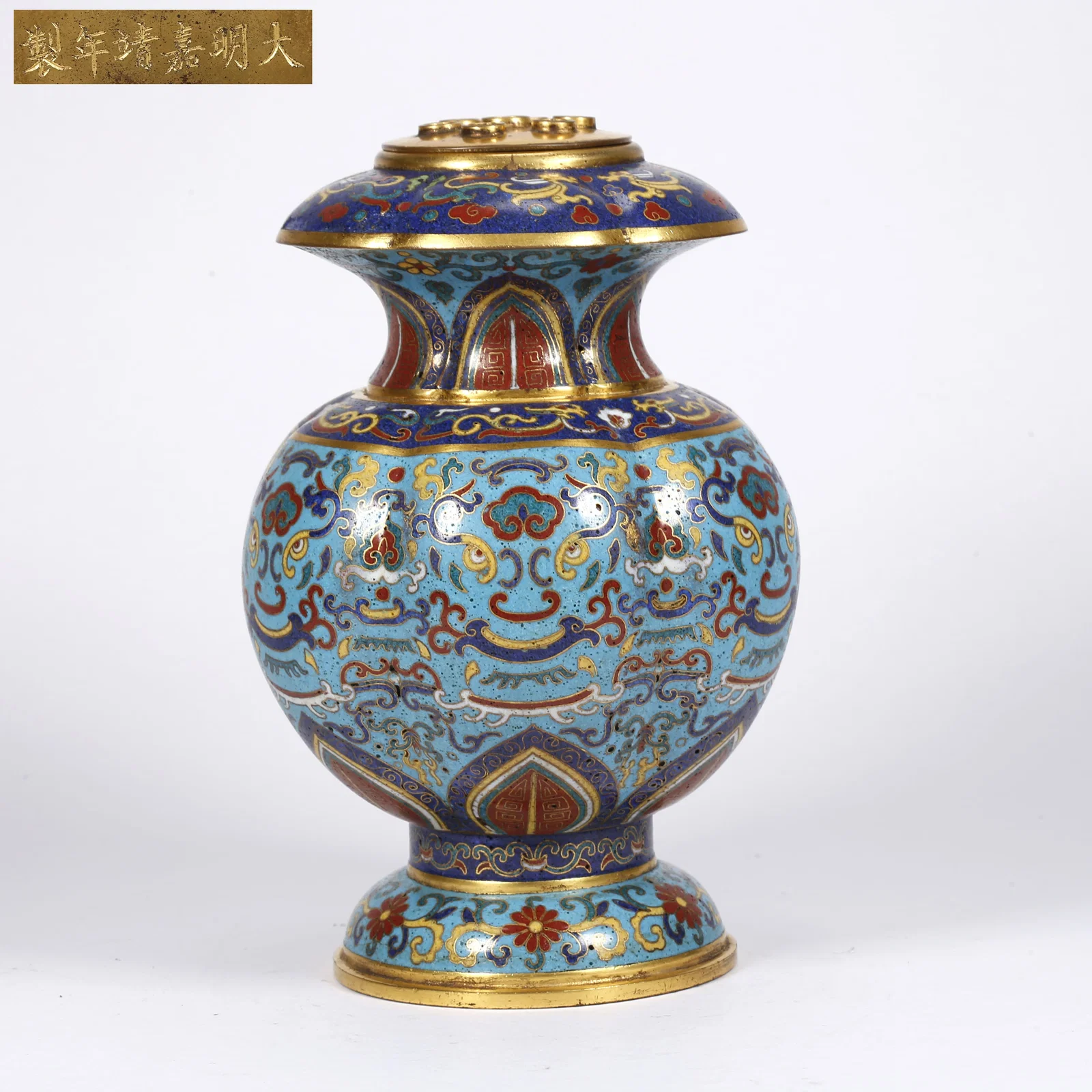 A BRONZE CLOISONNÉ FLOWER HOLDER