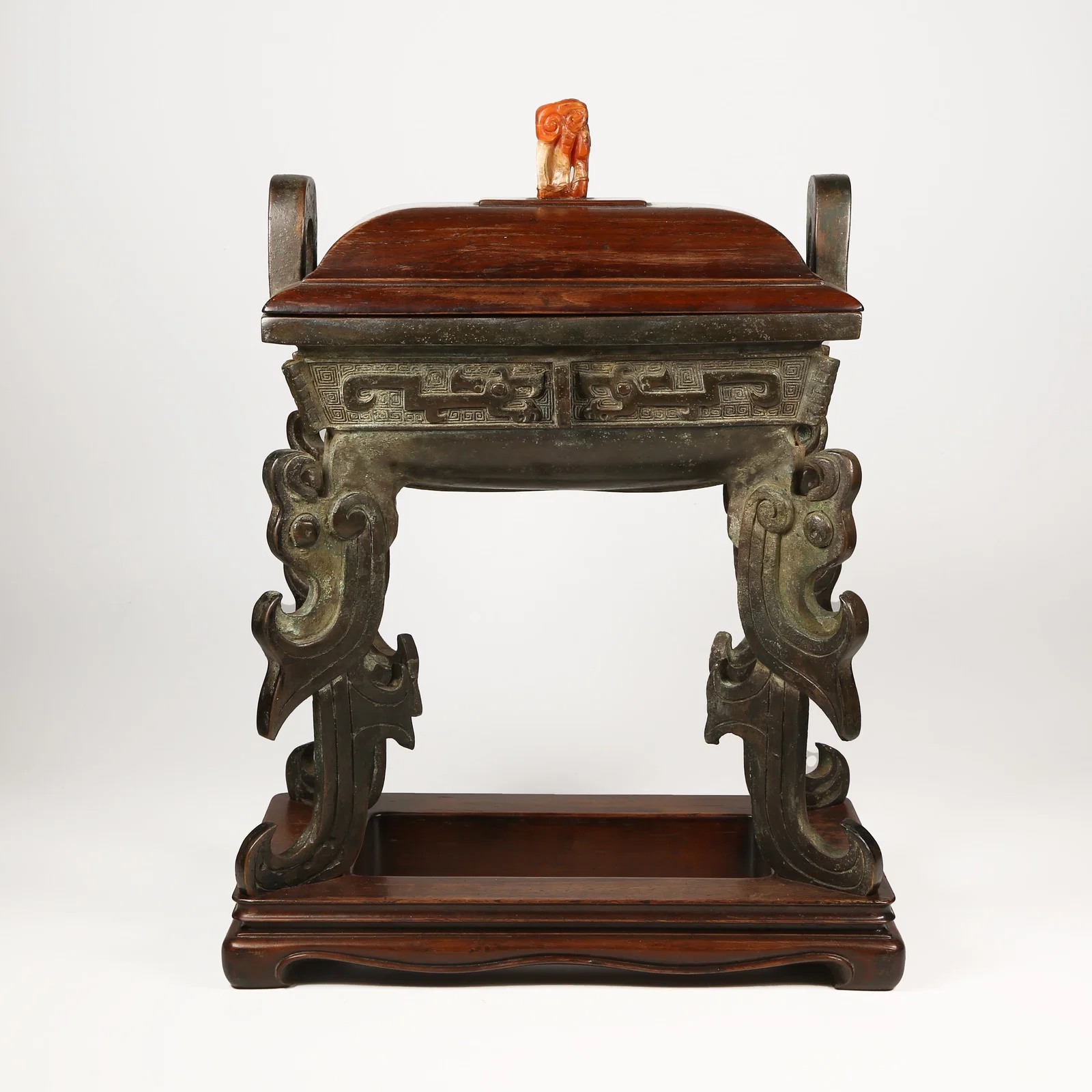 A BRONZE DING-SHAPED CENSER WITH FOUR PHOENIX FEET AND UPRIGHT FINIALS