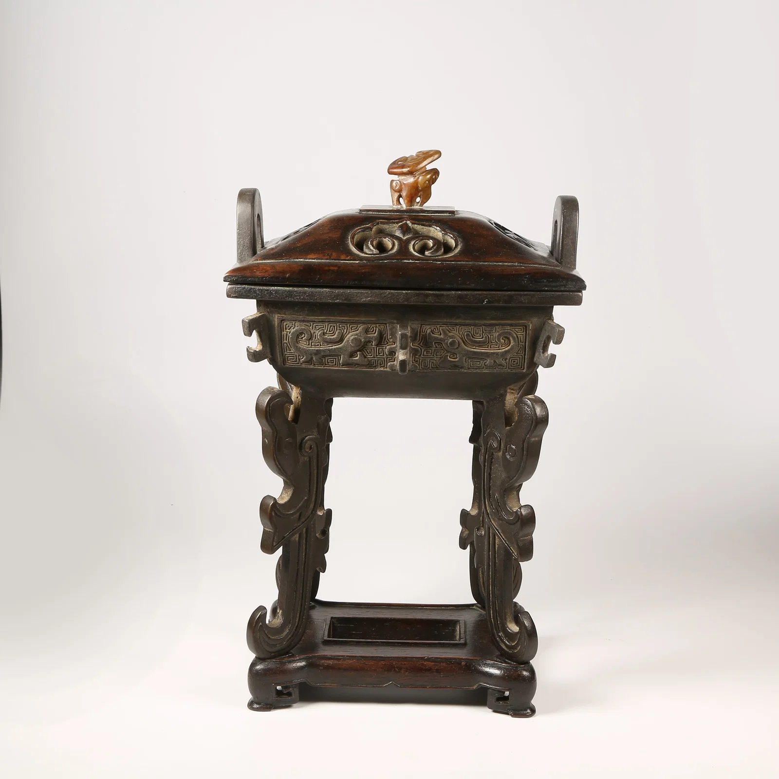 A BRONZE DING-SHAPED CENSER WITH PHOENIX MOTIFS AND UPRIGHT FINIALS