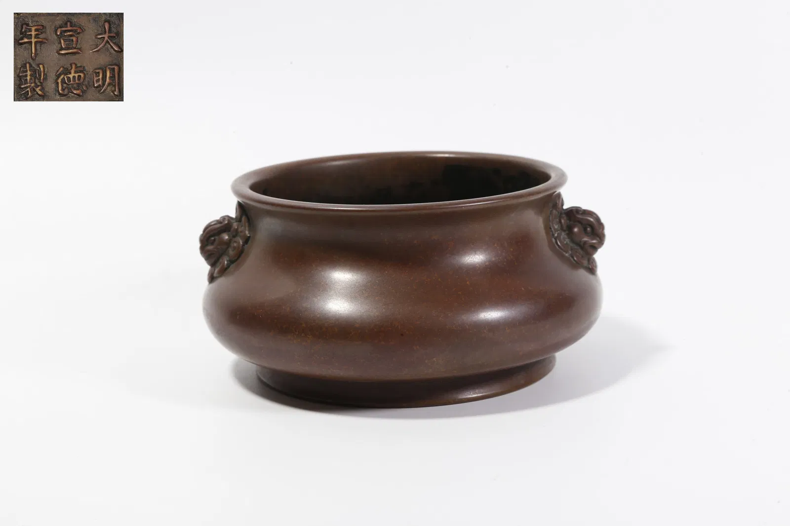 A BRONZE DOUBLE-BEAST-HANDLED INCENSE BURNER