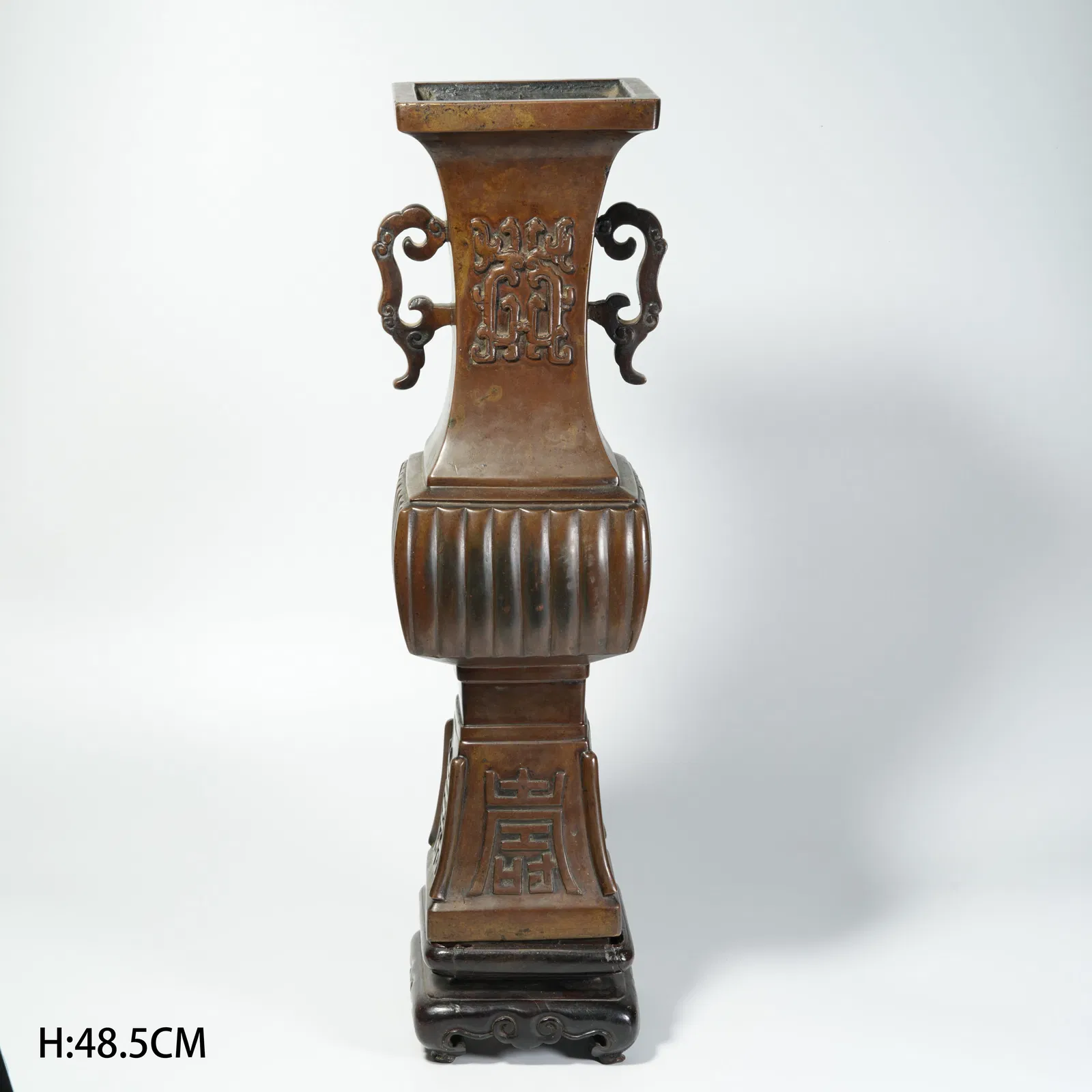 A BRONZE DOUBLE-HANDLED FLOWER-FORM VASE