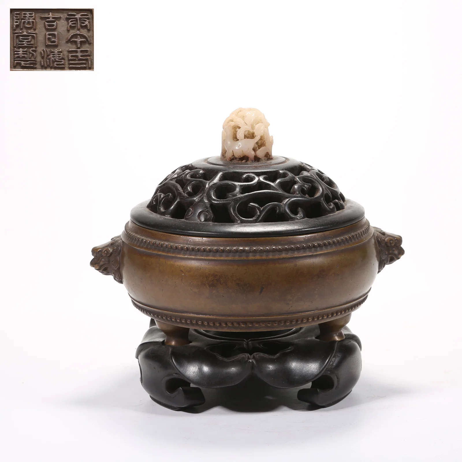 A BRONZE DRUM-SHAPED CENSER WITH LION HANDLES