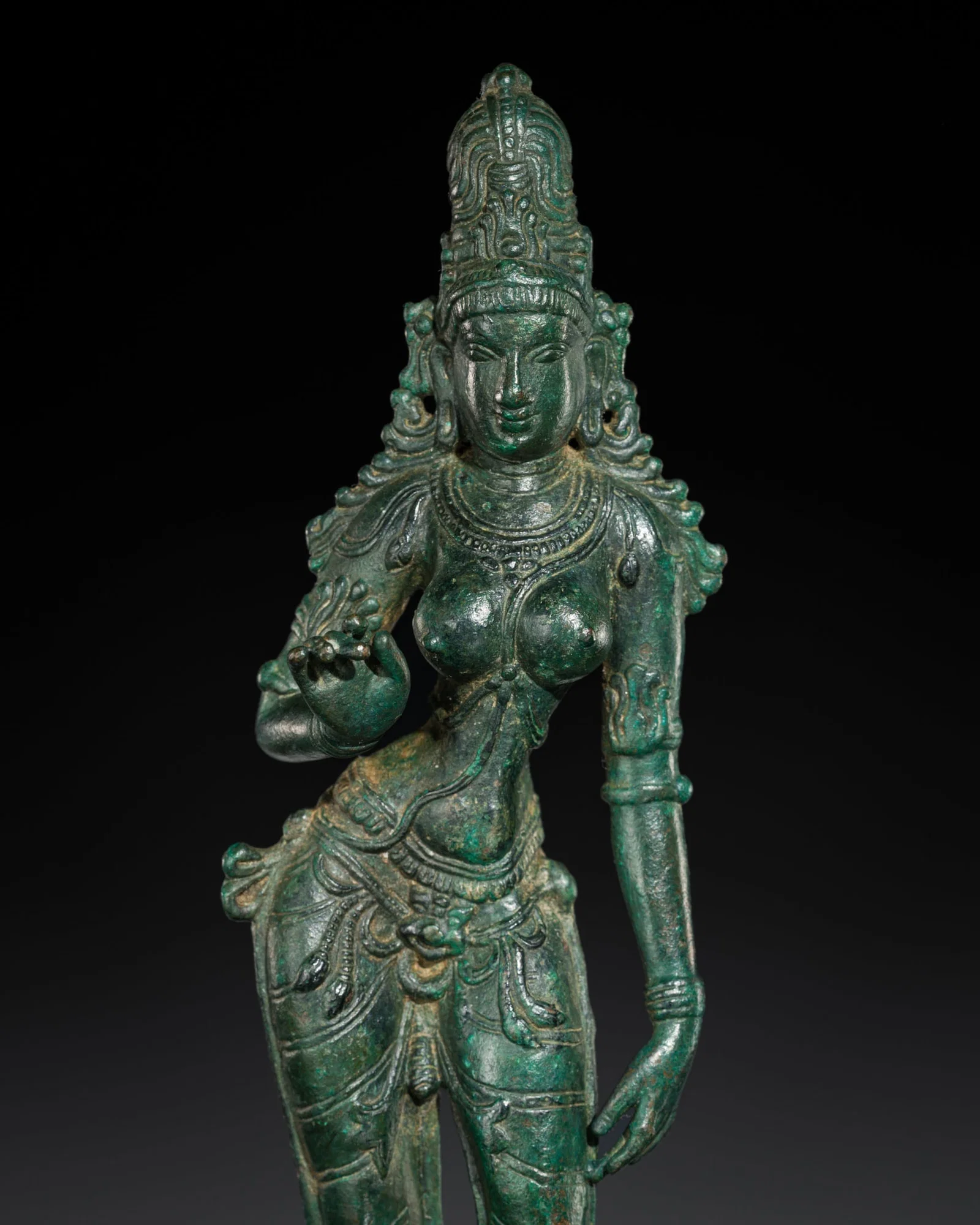 A BRONZE FIGURE OF PARVATI, SPHERE OF THE CHOLA EMPIRE, SOUTHEAST ASIA, 13TH-14TH CENTURY