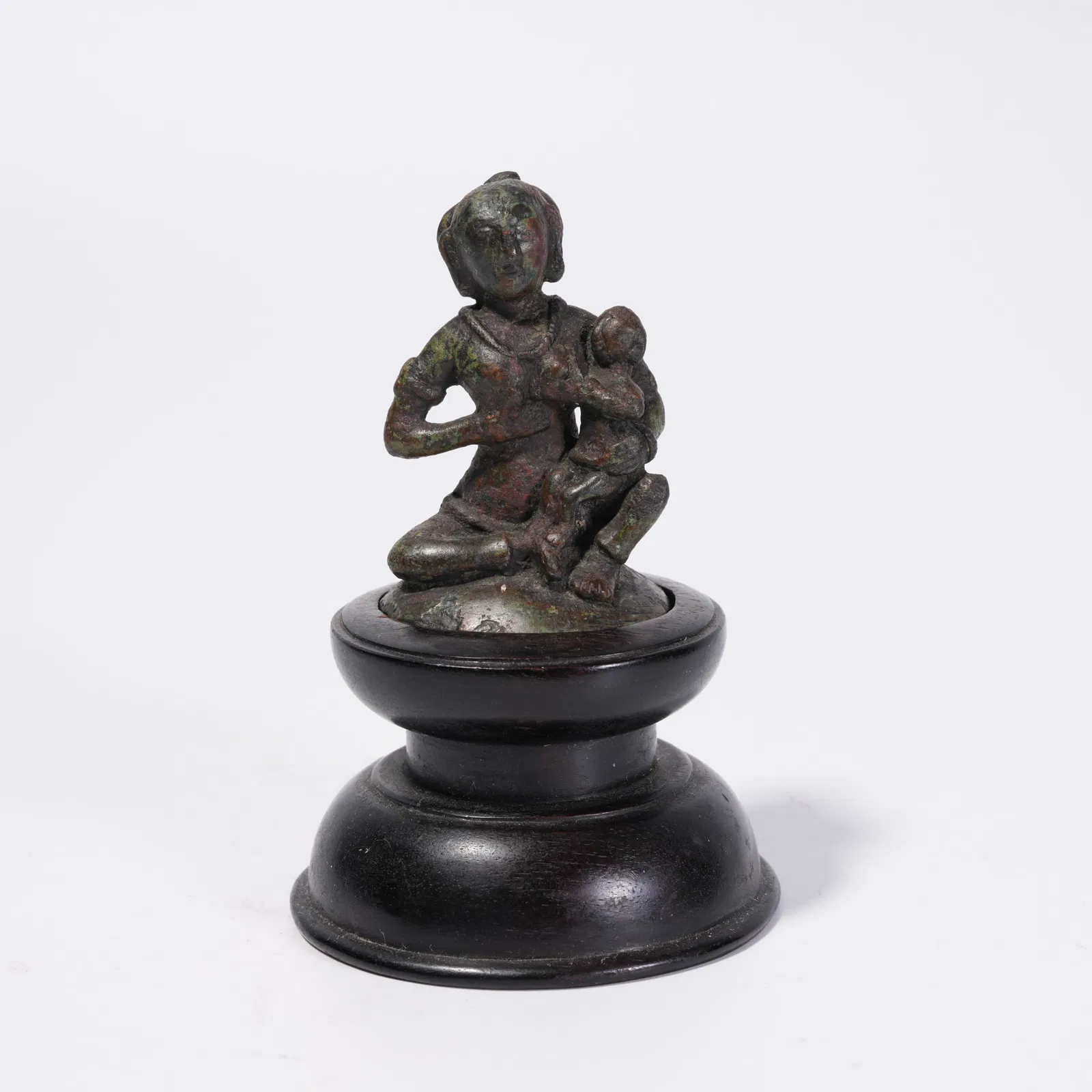 A BRONZE FIGURE ORNAMENT