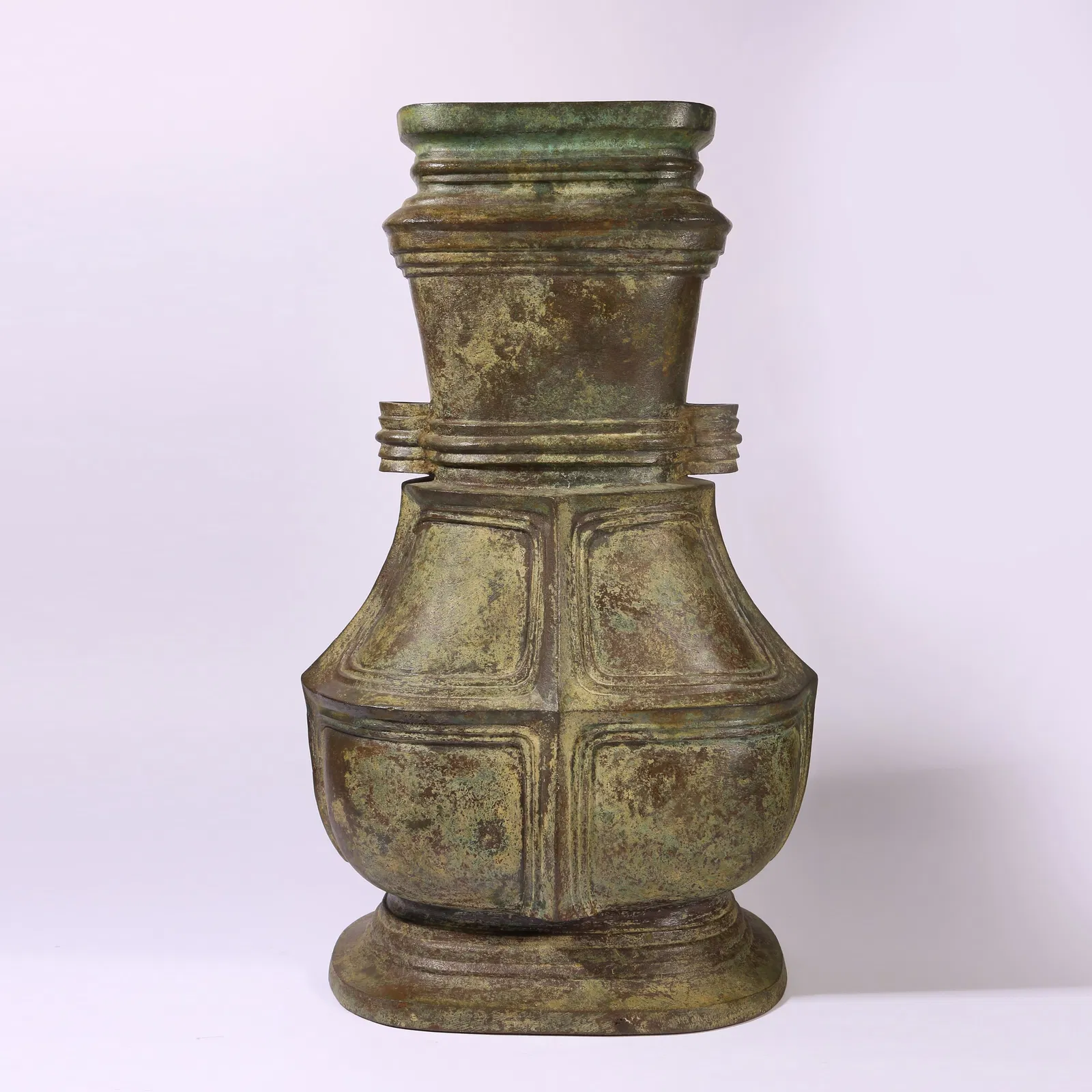 A BRONZE FLAT-HANDLED HU