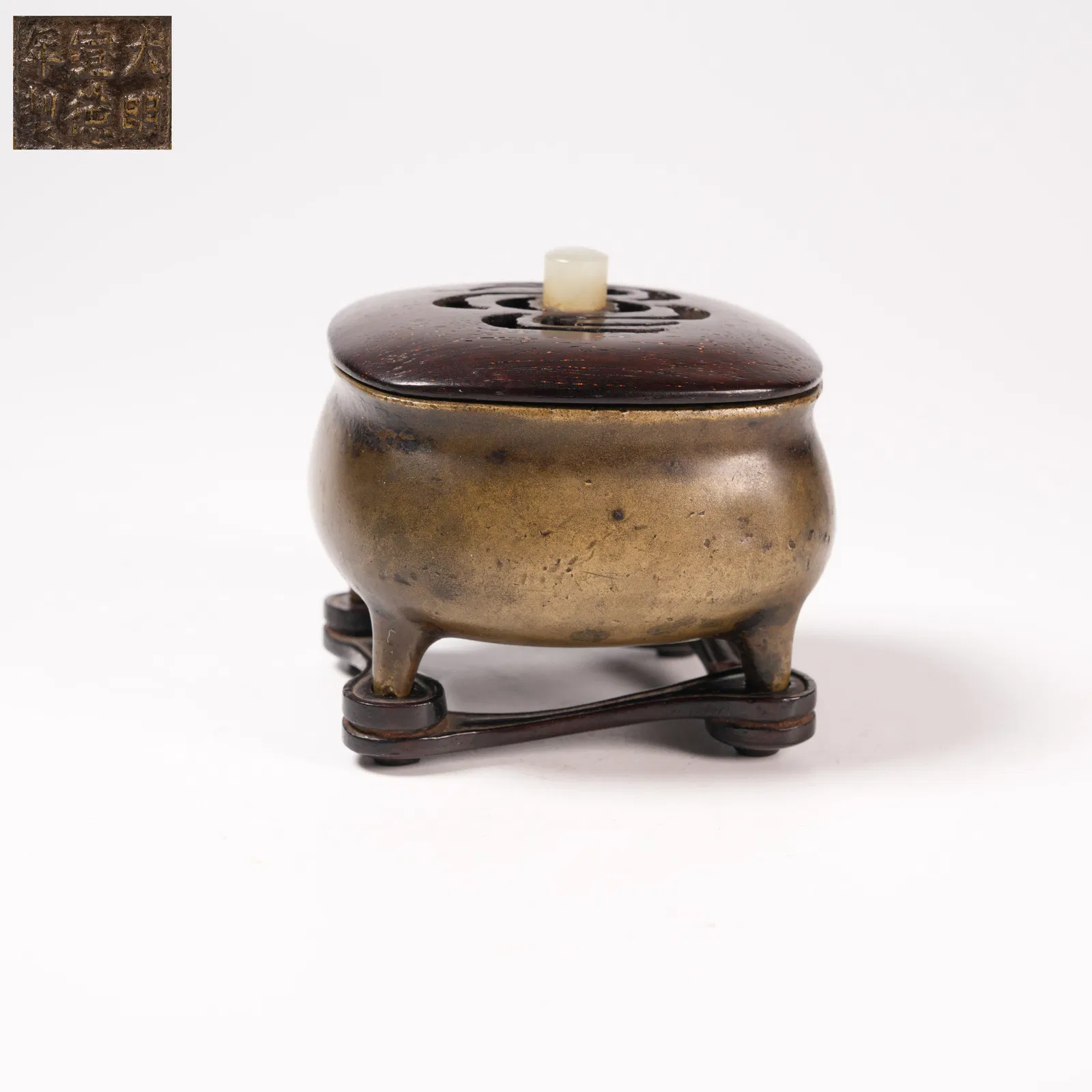 A BRONZE FOUR-LEGGED CENSER