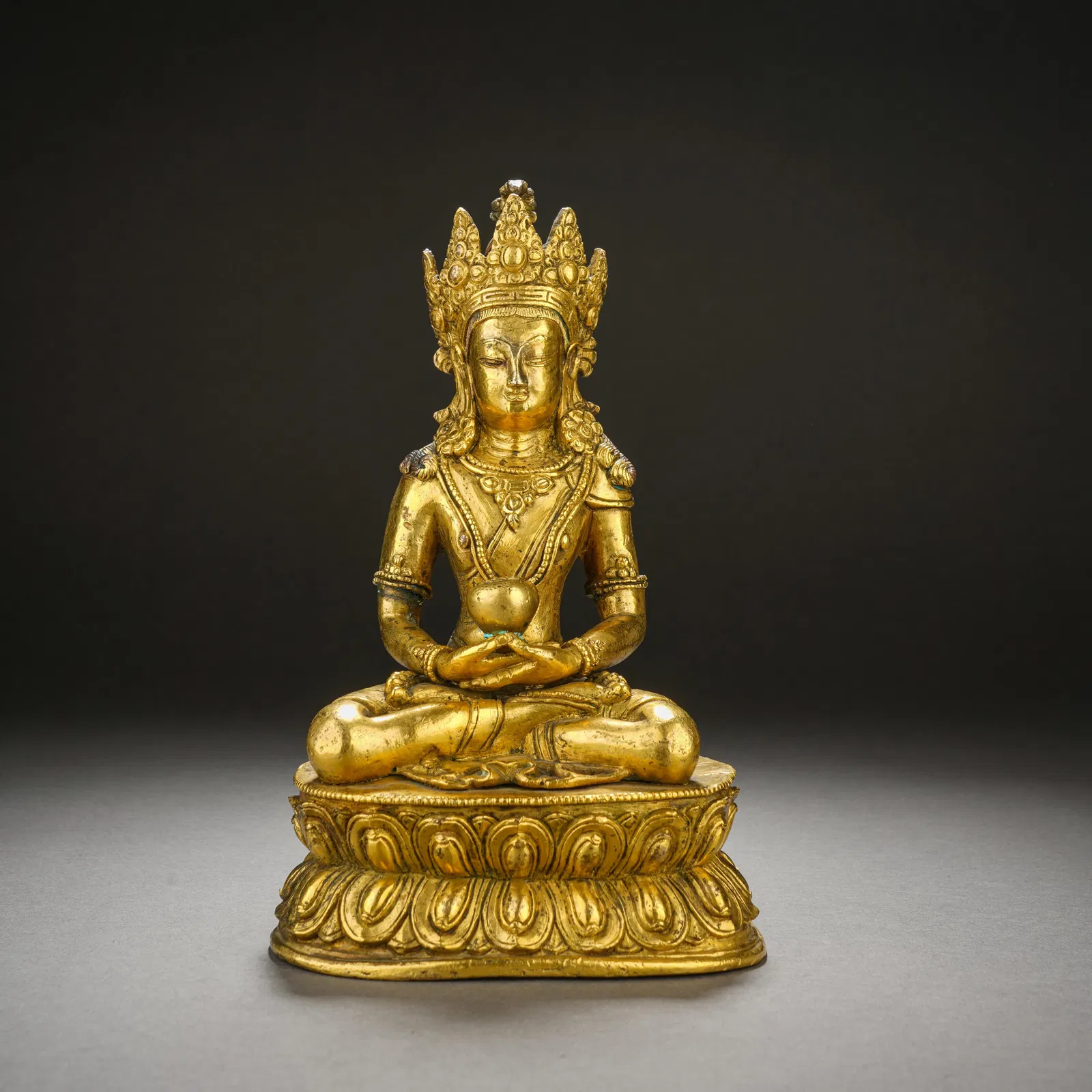 A BRONZE-GILT FIGURE OF AMITAYUS