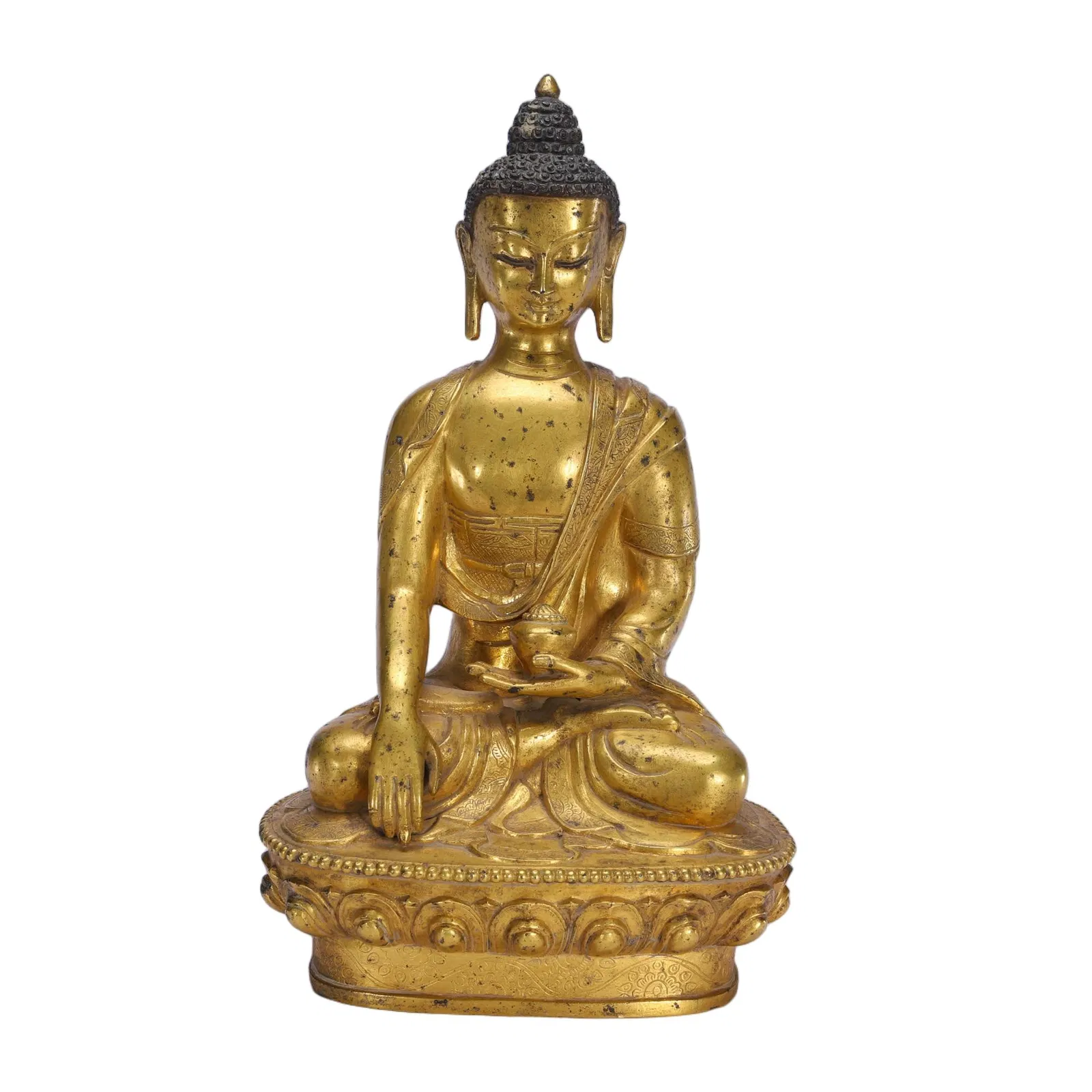 A BRONZE-GILT FIGURE OF SHAKYAMUNI