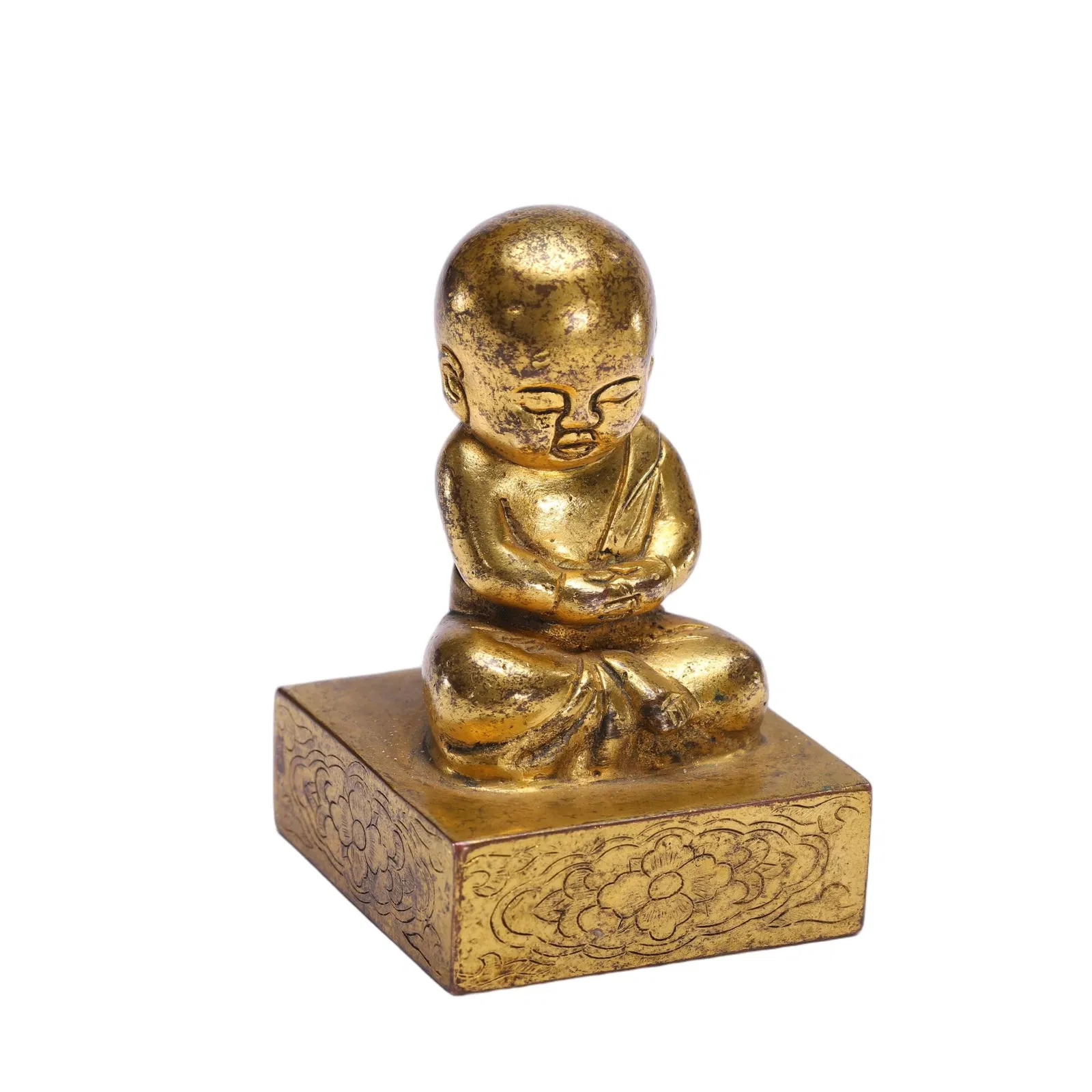 A BRONZE-GILT MONK SEAL