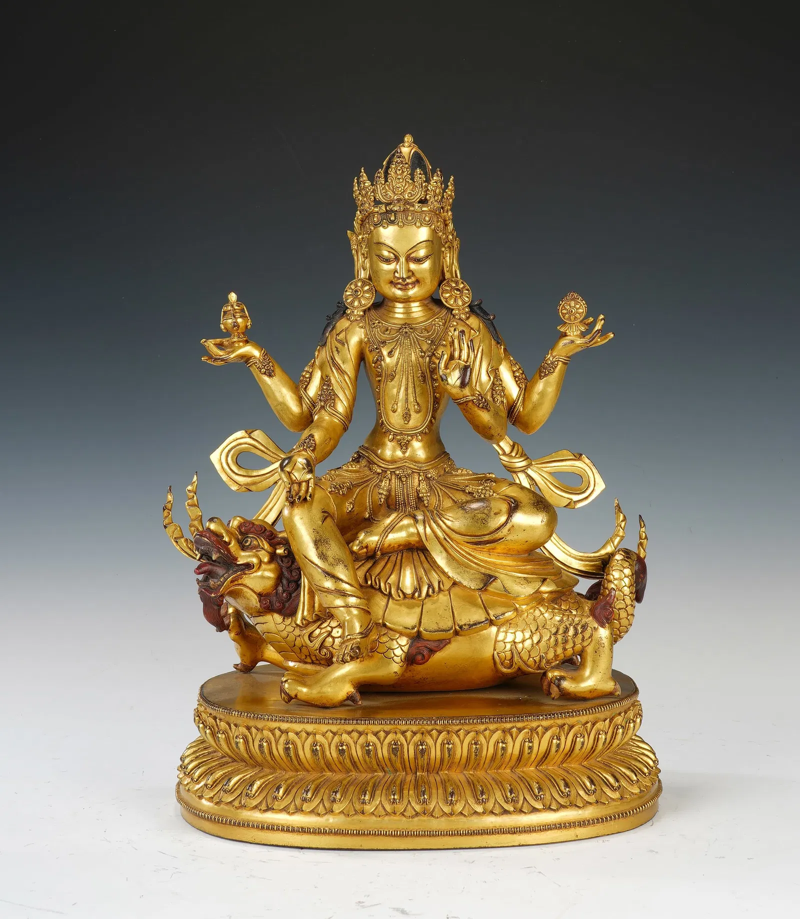 A BRONZE-GILT SEATED BODHISATTVA