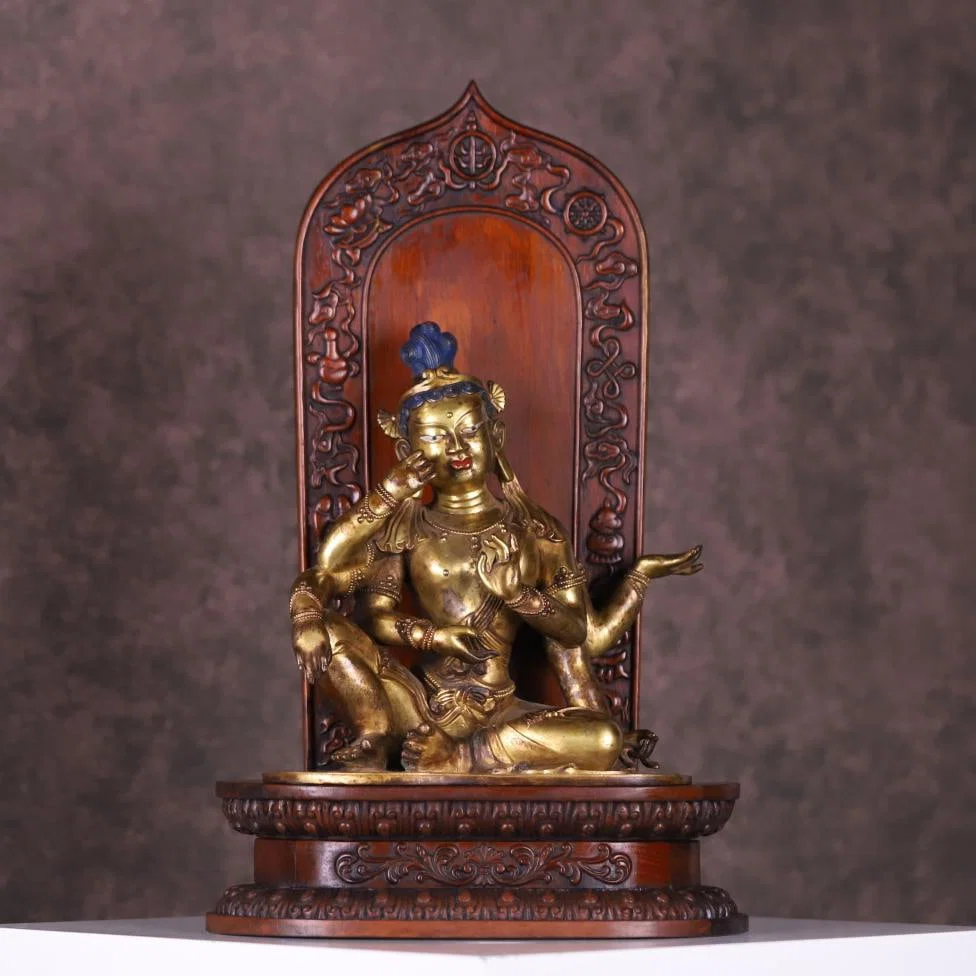 A bronze gilt six-armed Buddha Mother statue from the Qing Dynasty with a yellow pear woodcut