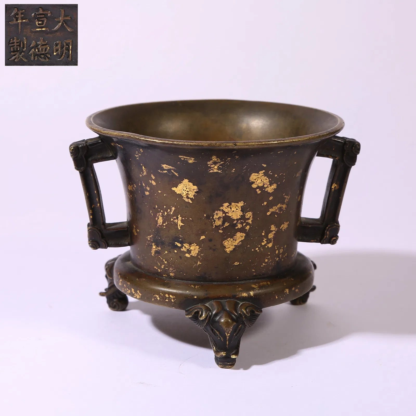 A BRONZE GOLD-SPLASHED RITUAL LAMP