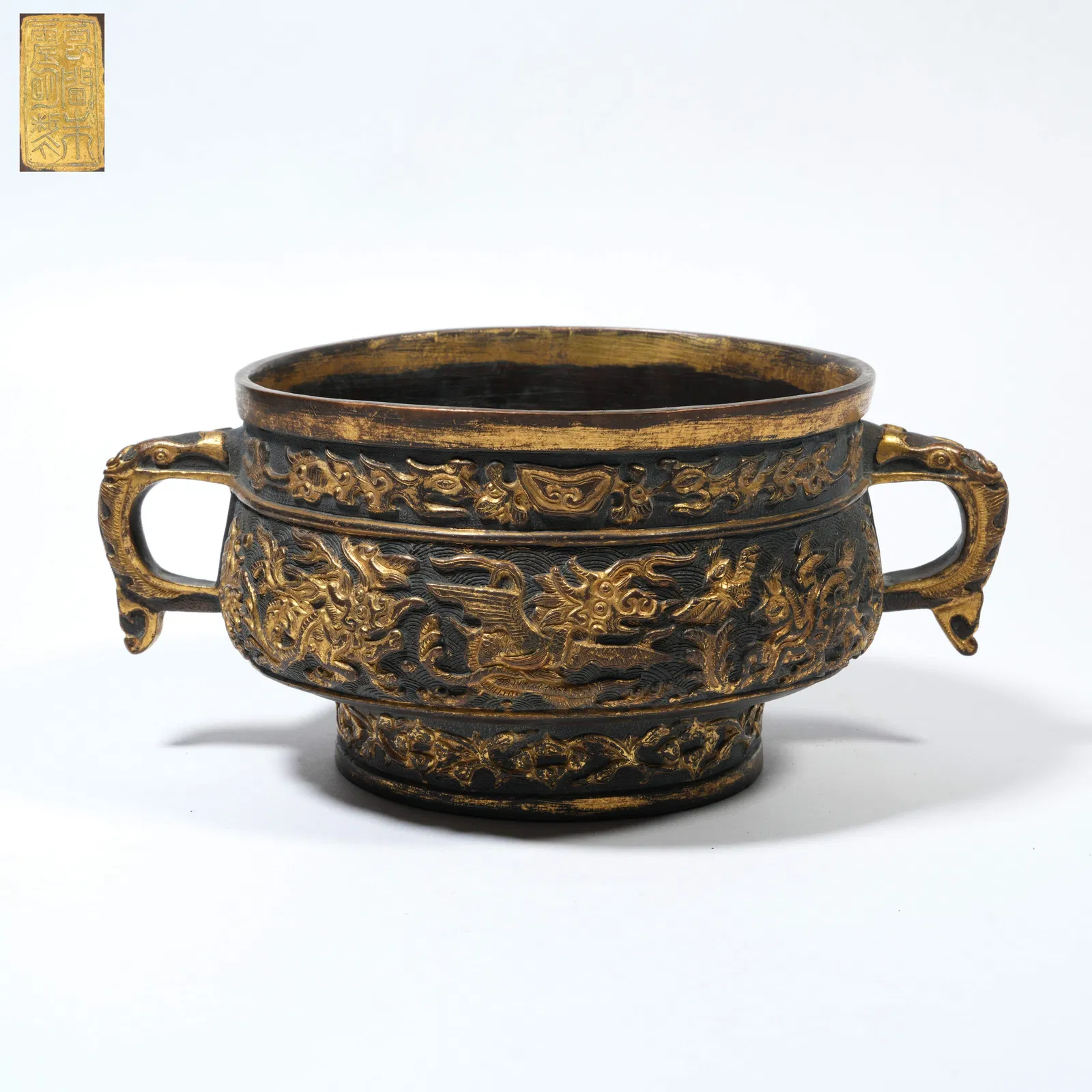 A BRONZE GUI-FORM CENSER WITH SEA-CREATURE MOTIFS, PARTIALLY GILT, MADE BY HU WENMING