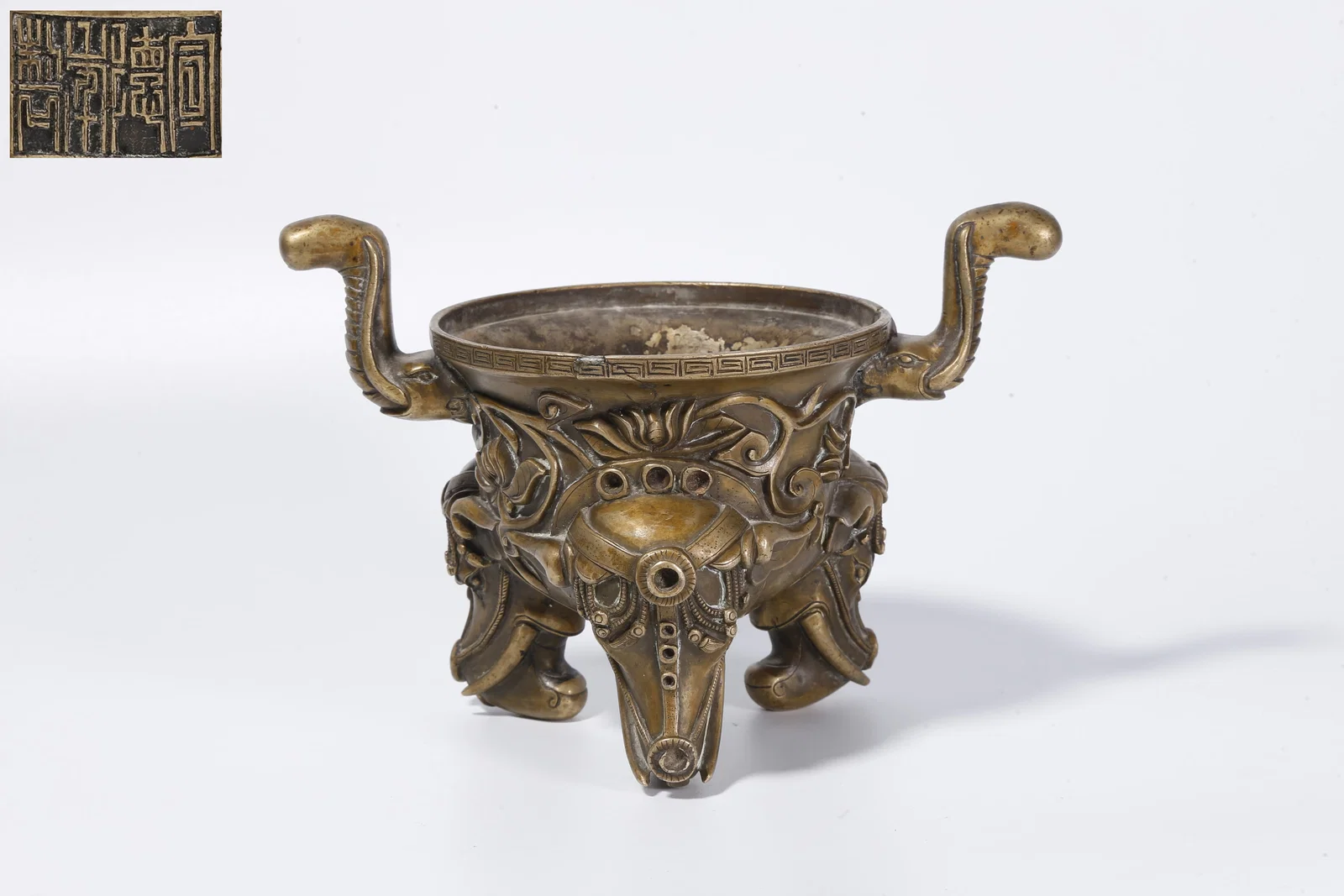 A BRONZE INCENSE BURNER WITH DOUBLE ELEPHANT HANDLES