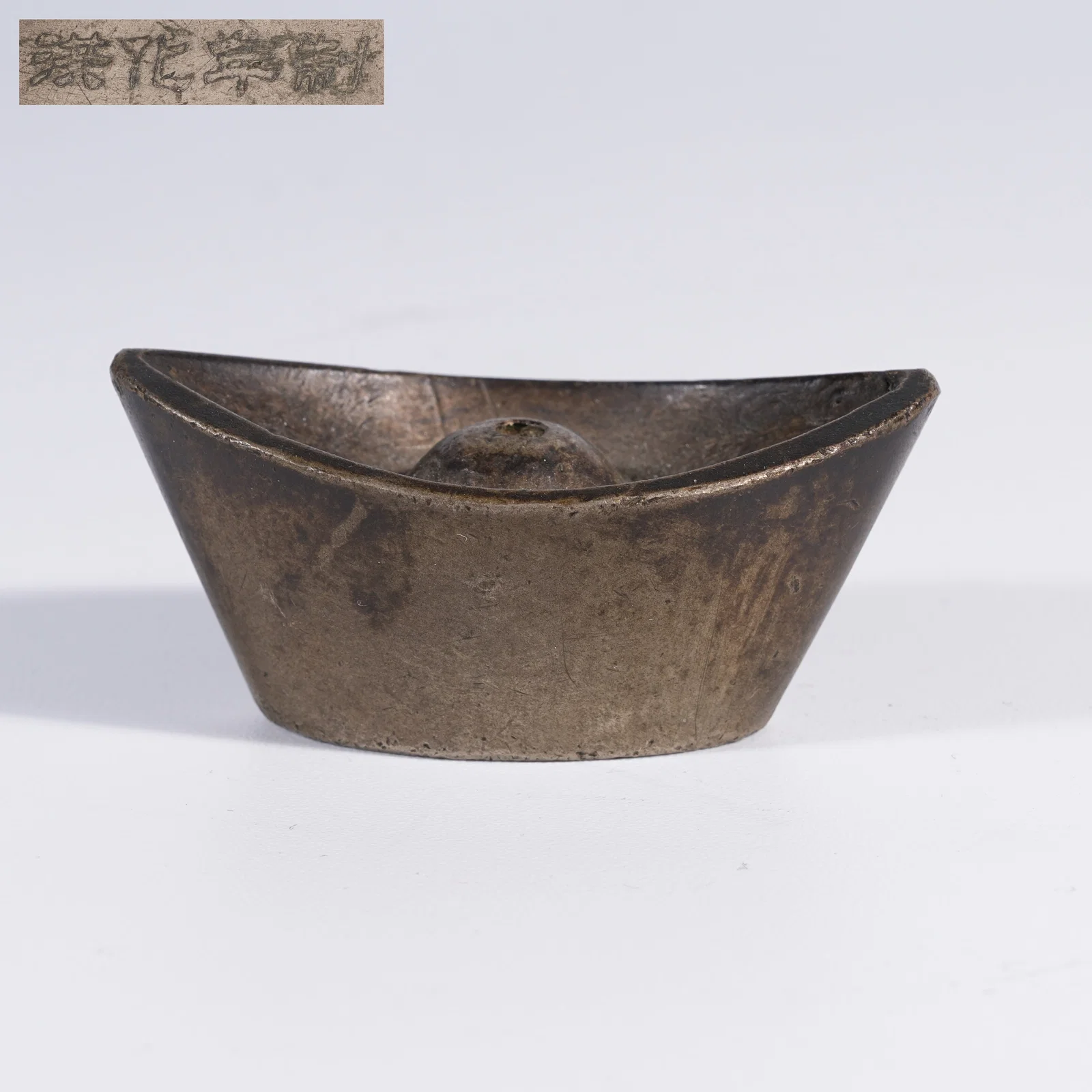 A BRONZE INGOT INCENSE HOLDER