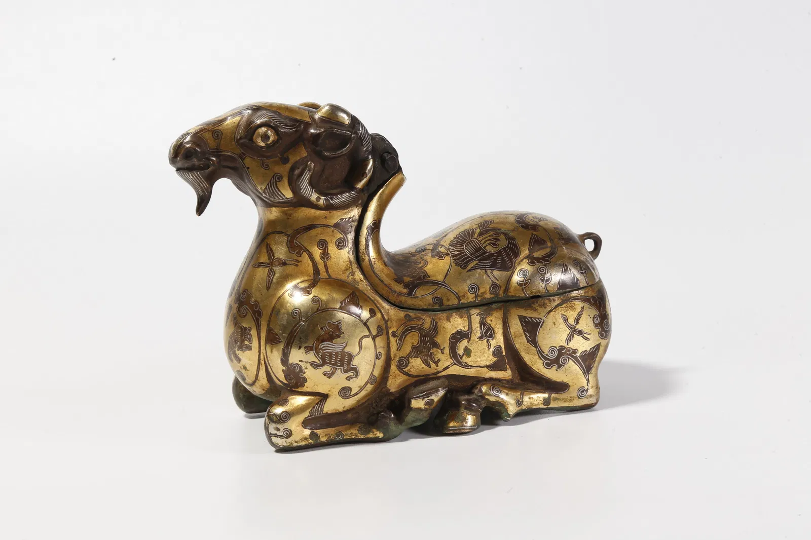 A BRONZE INLAID GOLD AND SILVER SHEEP FIGURINE
