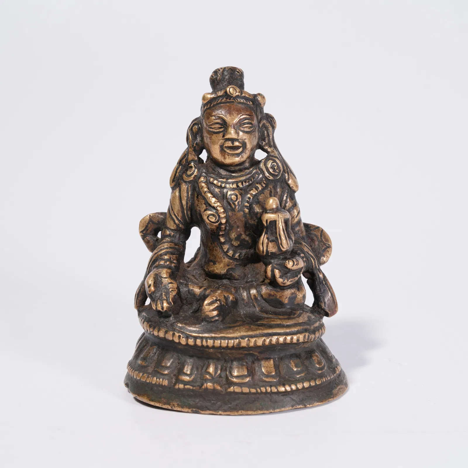 A BRONZE JAMBHALA STATUE