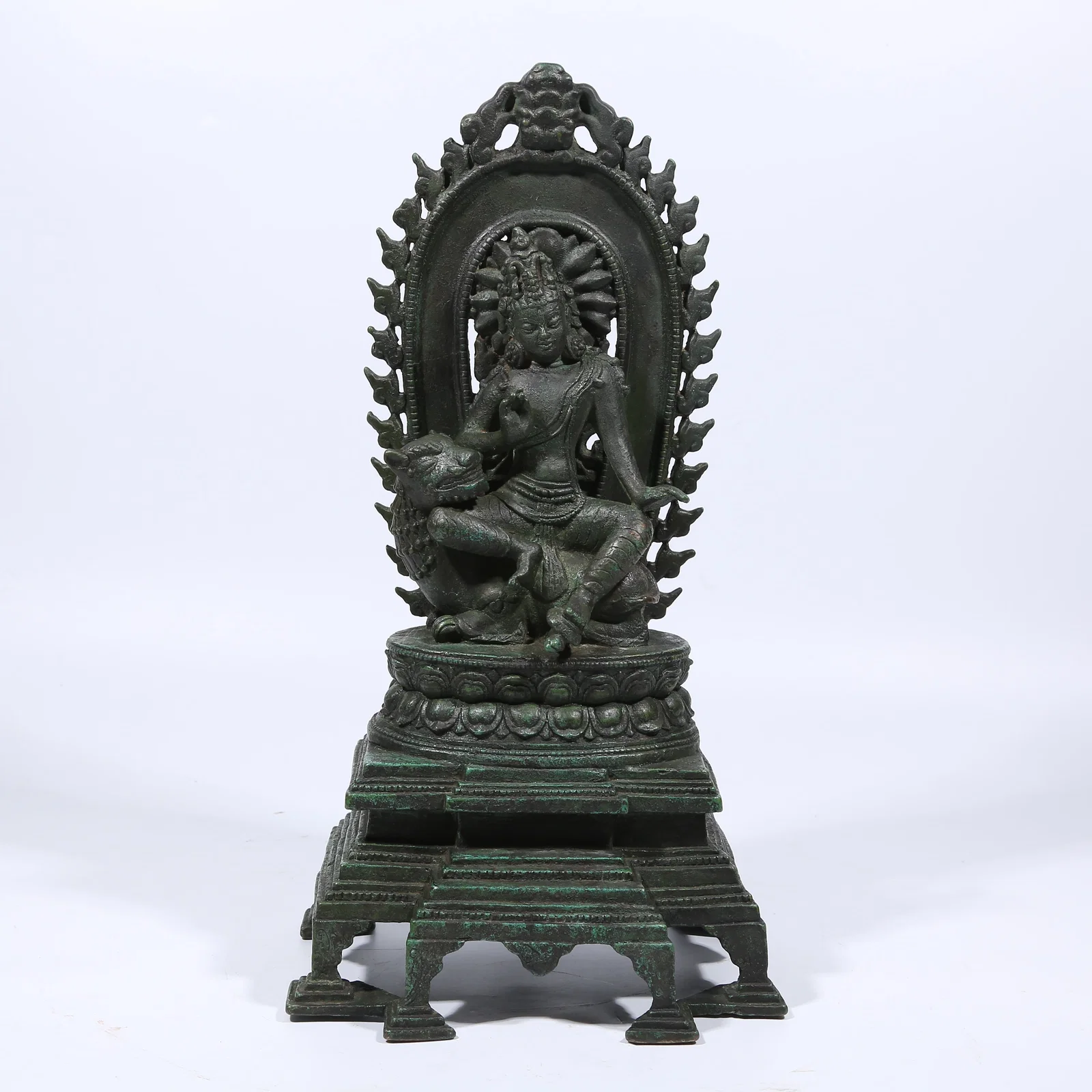 A BRONZE LION'S ROAR AVALOKITESHVARA STATUE