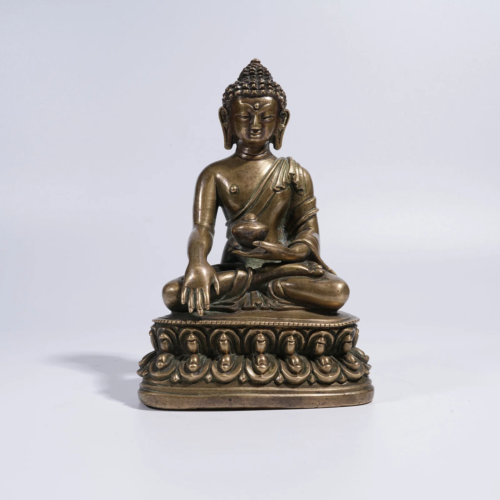 A BRONZE MEDICINE BUDDHA STATUE