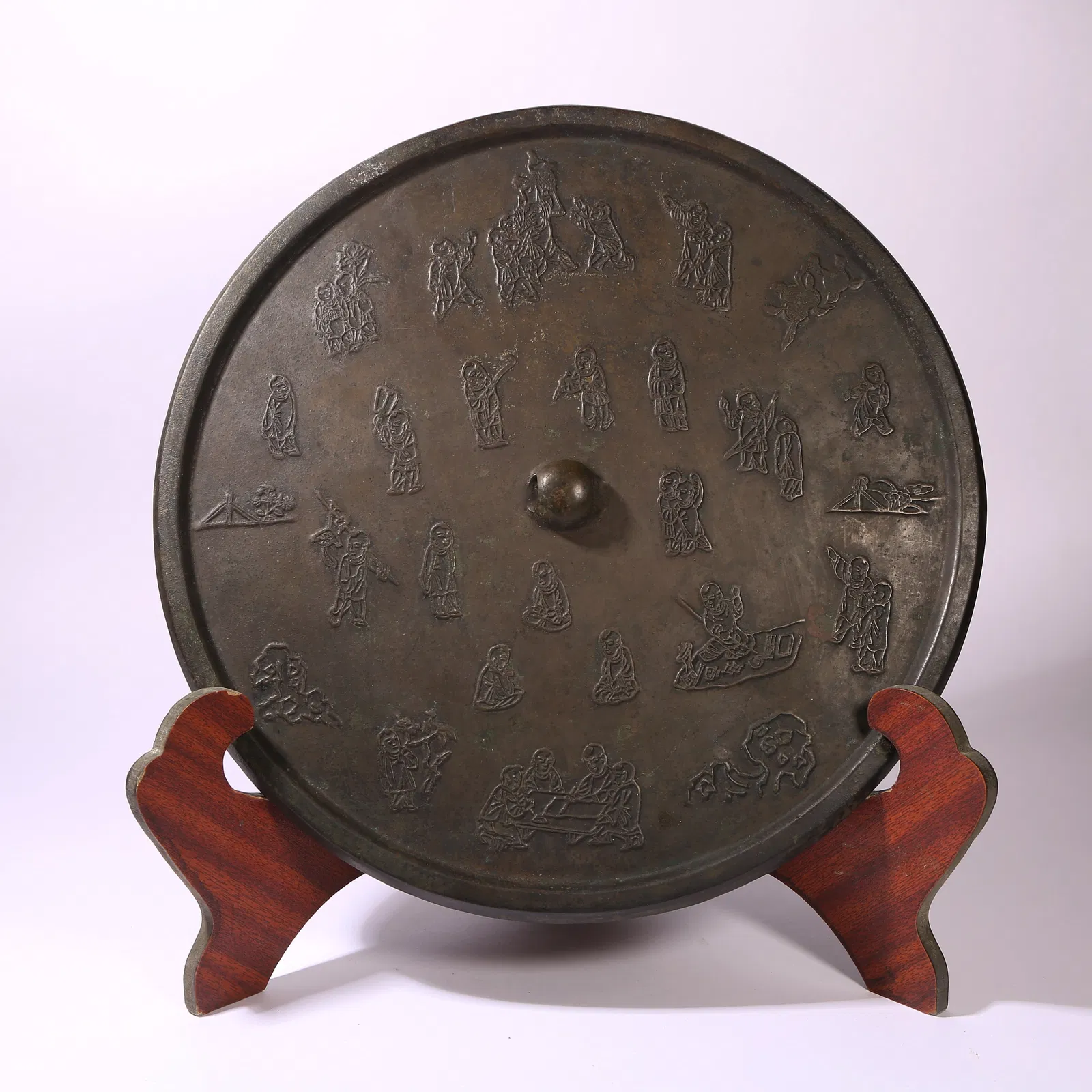 A BRONZE MIRROR WITH PLAYING CHILDREN MOTIF