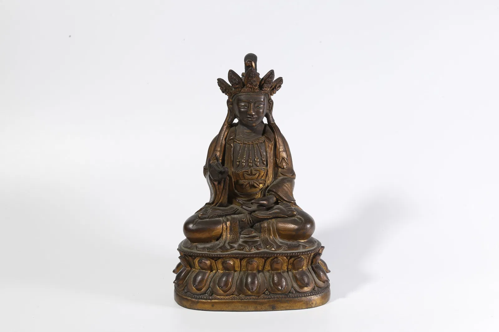 A BRONZE PARTIALLY GILT BUDDHA STATUE