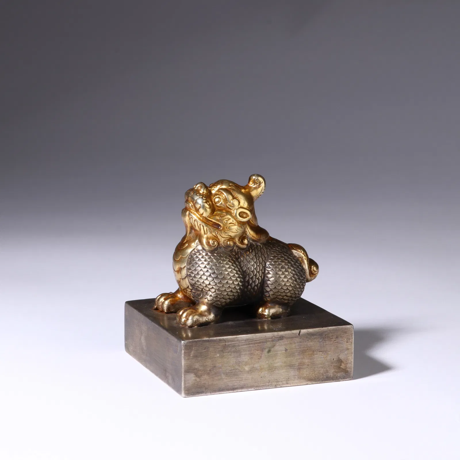 A BRONZE PARTLY GILT MYTHICAL BEAST SEAL