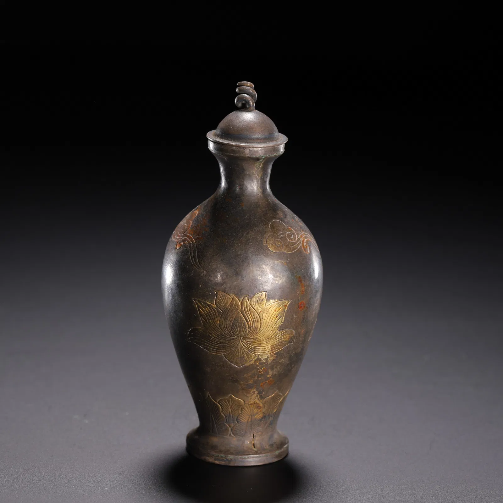 A BRONZE PARTLY GILT VASE WITH COVER
