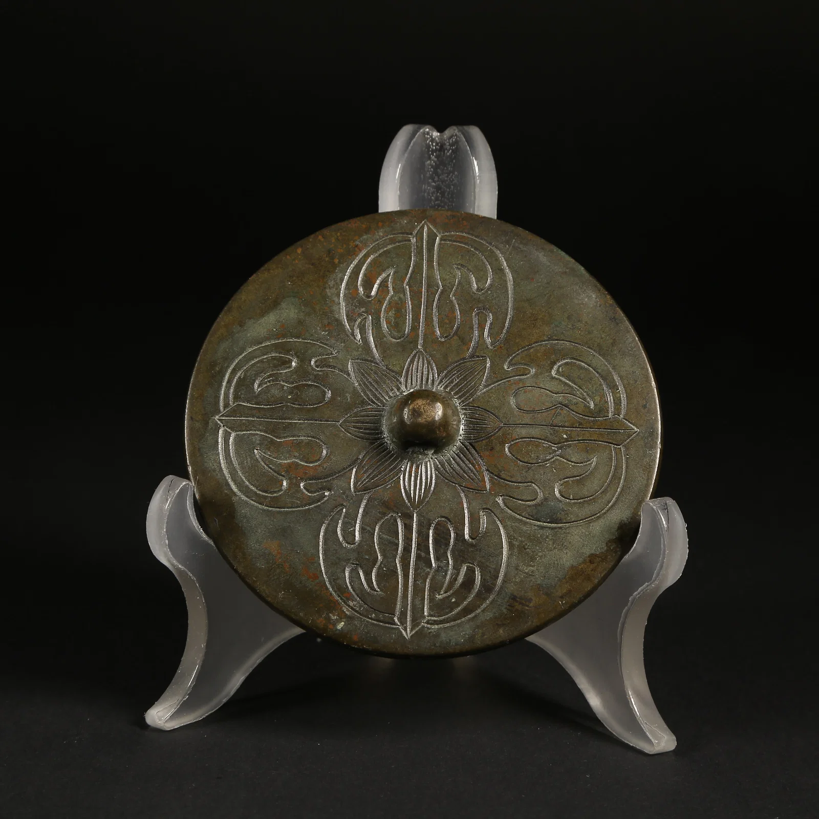 A BRONZE RITUAL IMPLEMENTS MIRROR