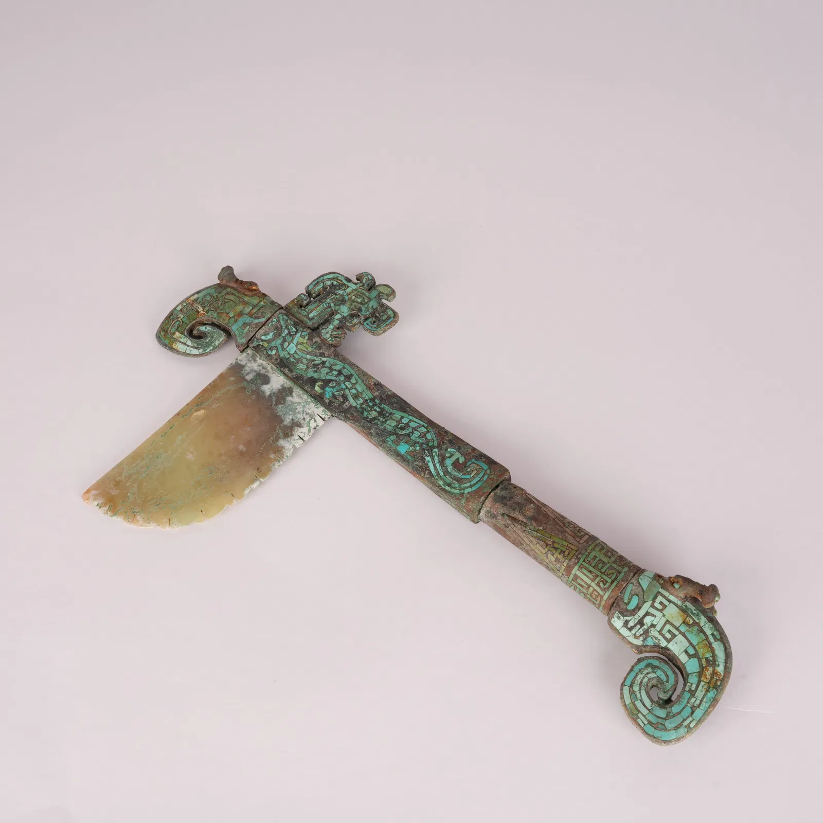 A BRONZE SCEPTER INLAID WITH TURQUOISE AND JADE, SHANG DYNASTY