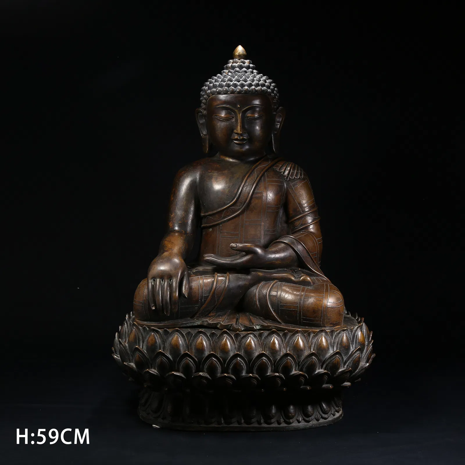 A BRONZE SHAKYAMUNI BUDDHA STATUE