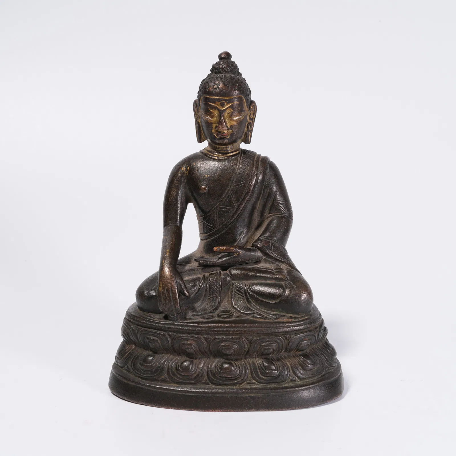 A BRONZE SHAKYAMUNI STATUE