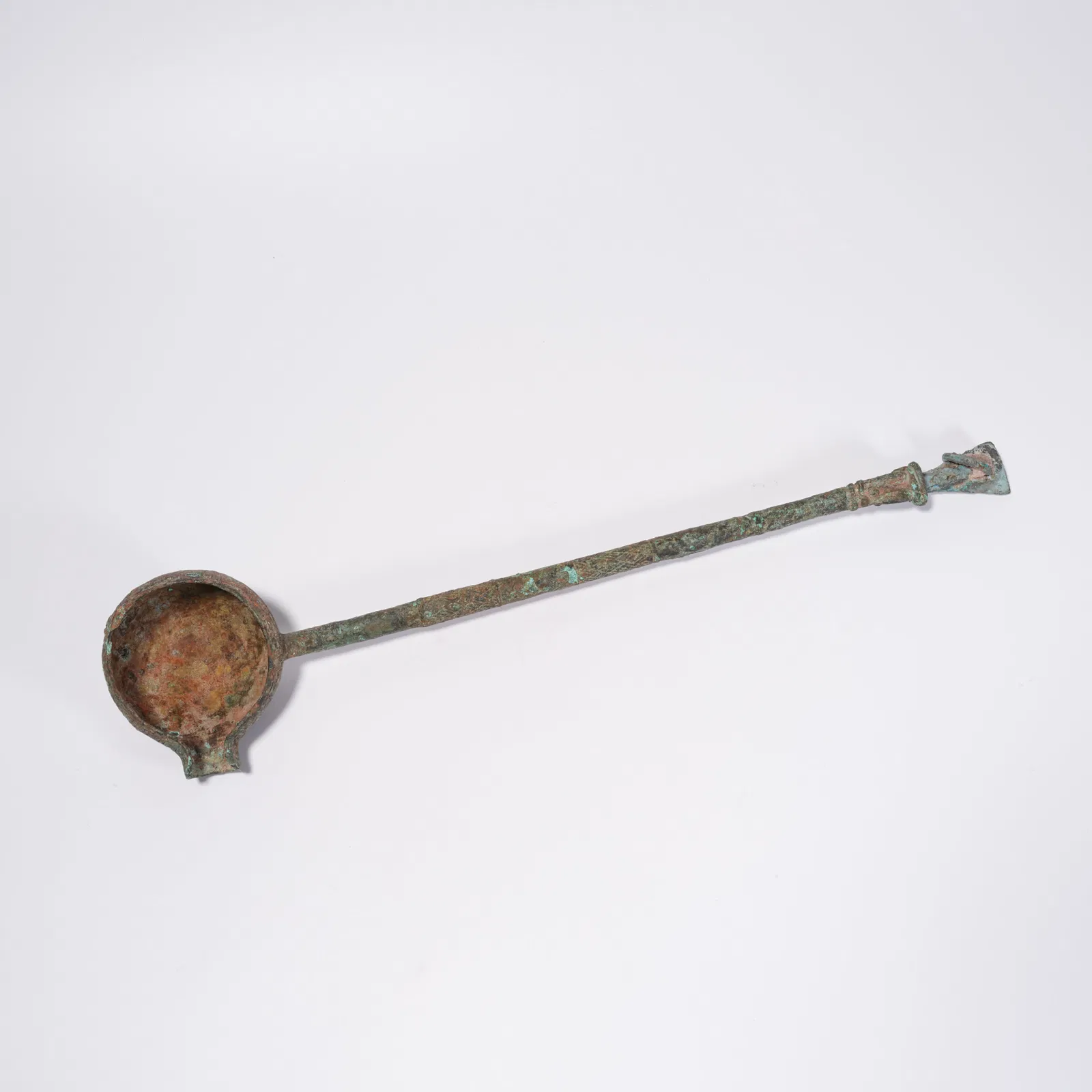 A BRONZE SPOON