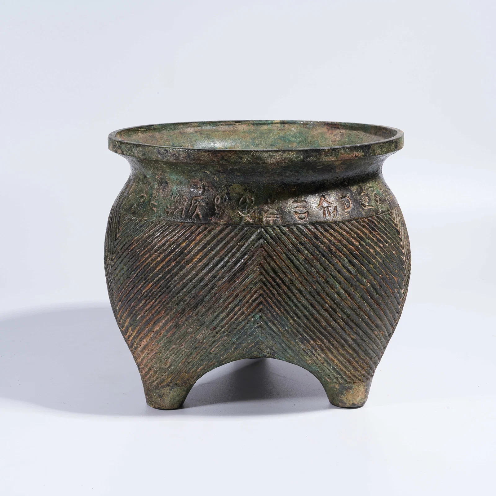 A BRONZE TRIPOD INCENSE BURNER