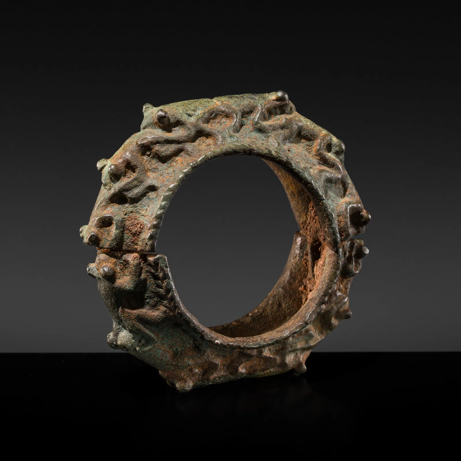 A BRONZE 'TWELVE FROG' BRACELET, DONG SON CULTURE, NORTHERN VIETNAM, CIRCA 100 BC