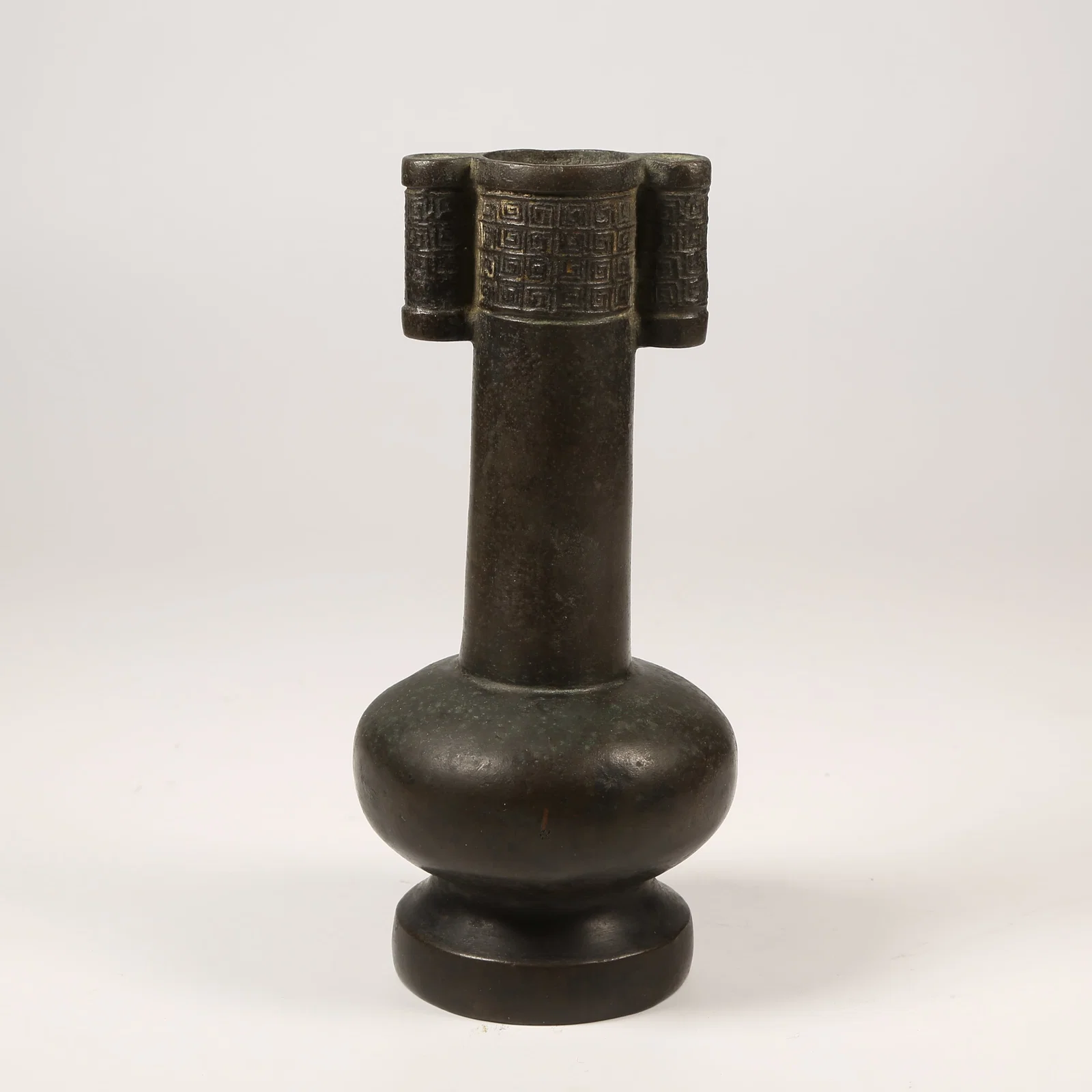 A BRONZE VASE WITH ANIMAL-FORM HANDLES