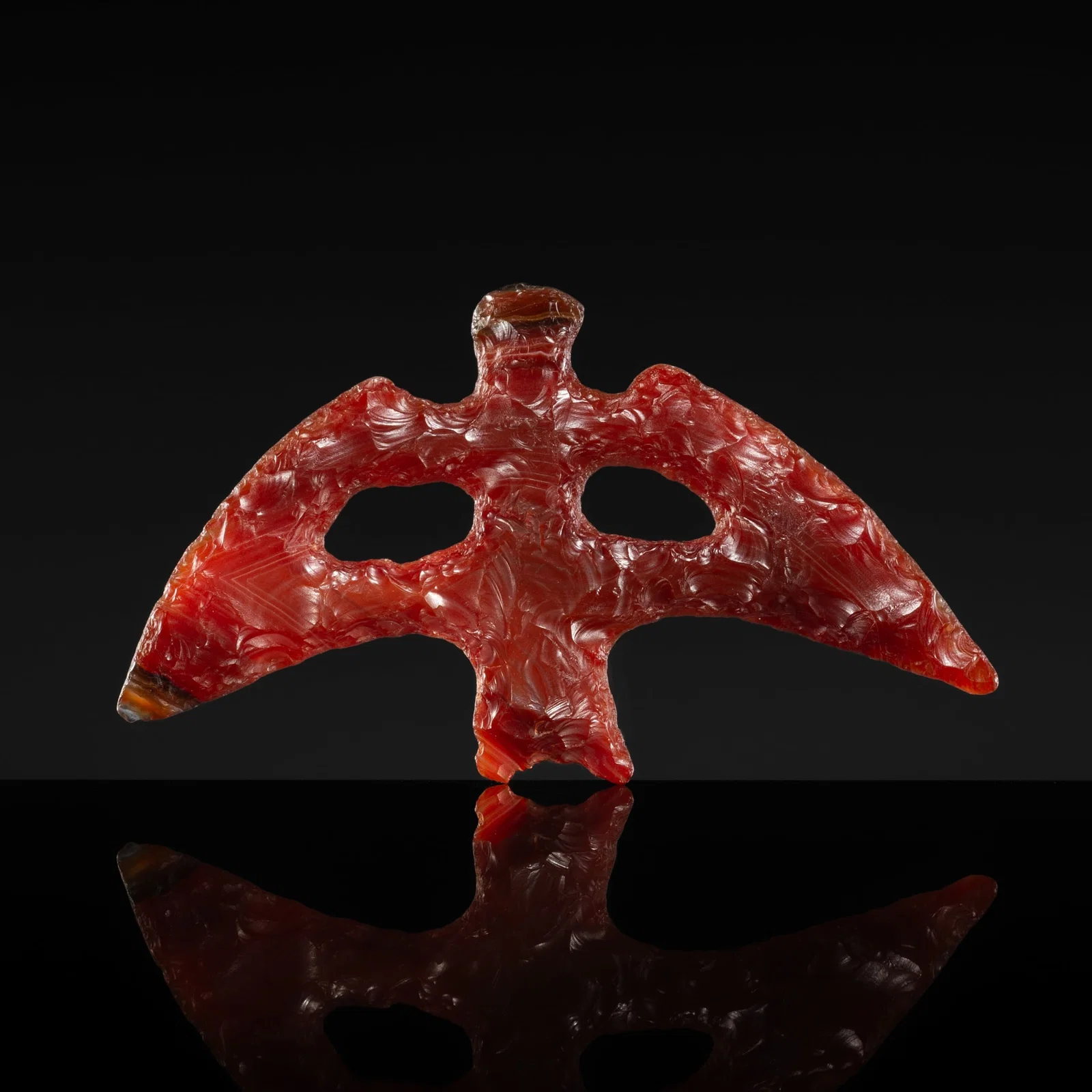 A CARNELIAN AGATE 'FLYING EAGLE' PENDANT, NEOLITHIC PERIOD, HONGSHAN CULTURE