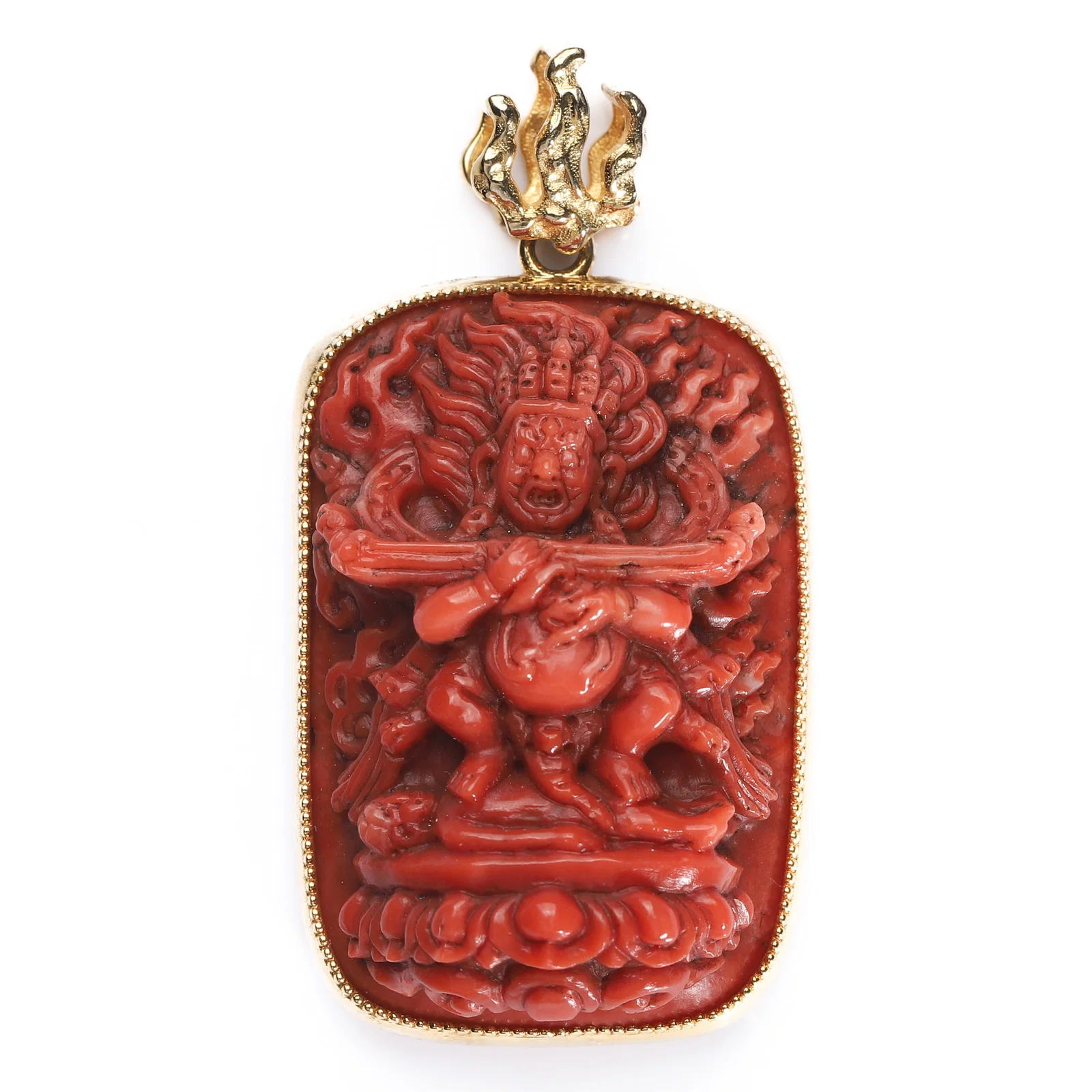 A CARVED CORAL VAJRAPANI PENDANT WITH GOLD MOUNT