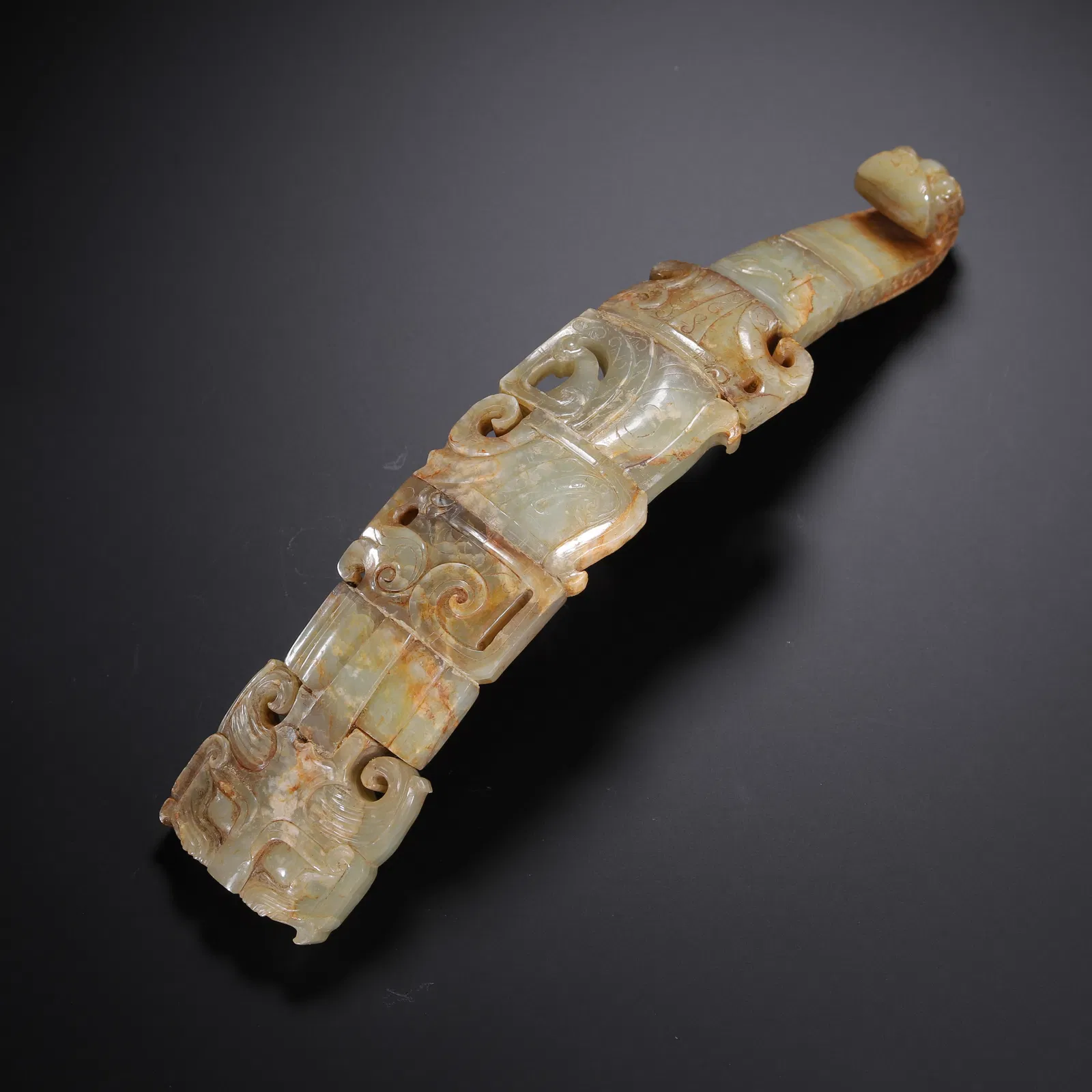 A CARVED JADE BELTHOOK