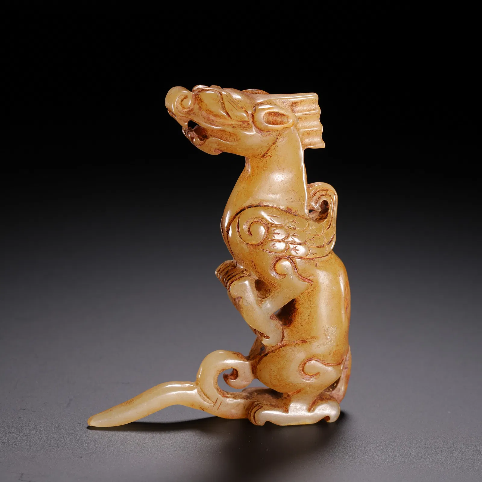 A CARVED JADE DRAGON