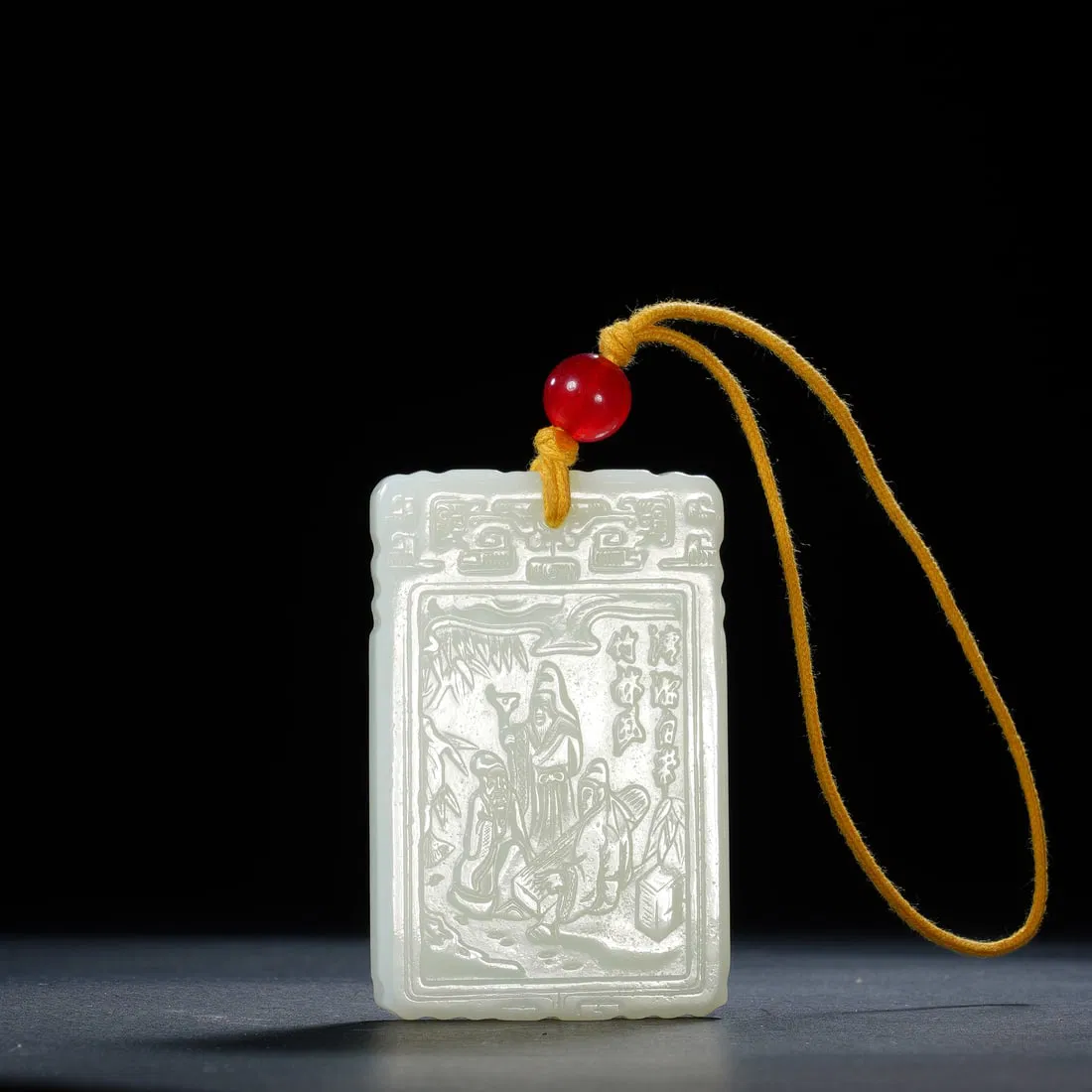 A CARVED WHITE JADE ABSTINENCE PLAQUE