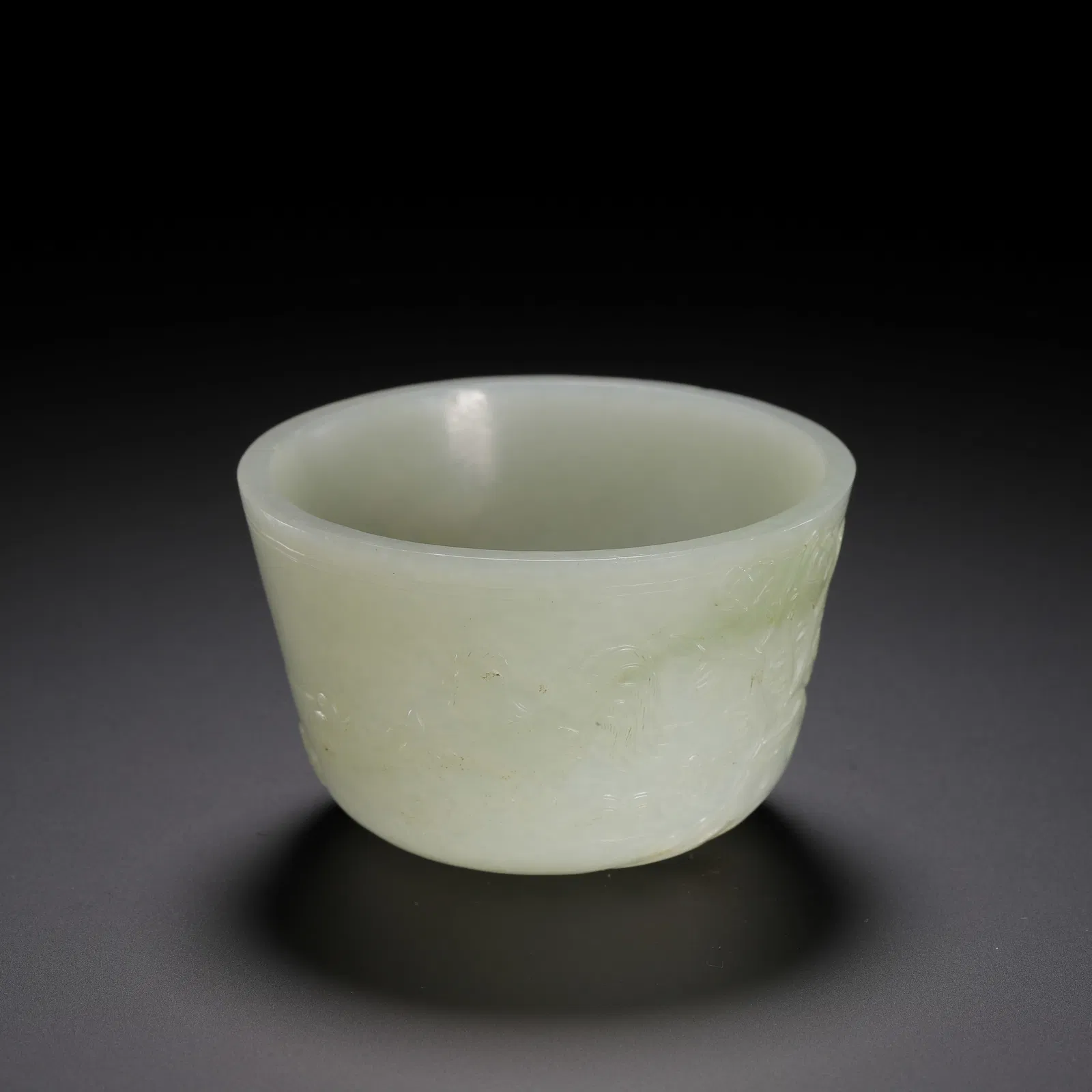 A CARVED WHITE JADE CUP