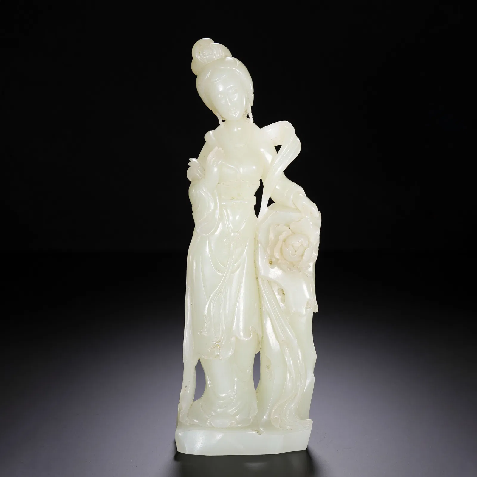 A CARVED WHITE JADE LADY