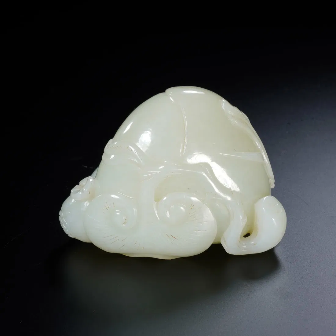 A CARVED WHITE JADE PEACH