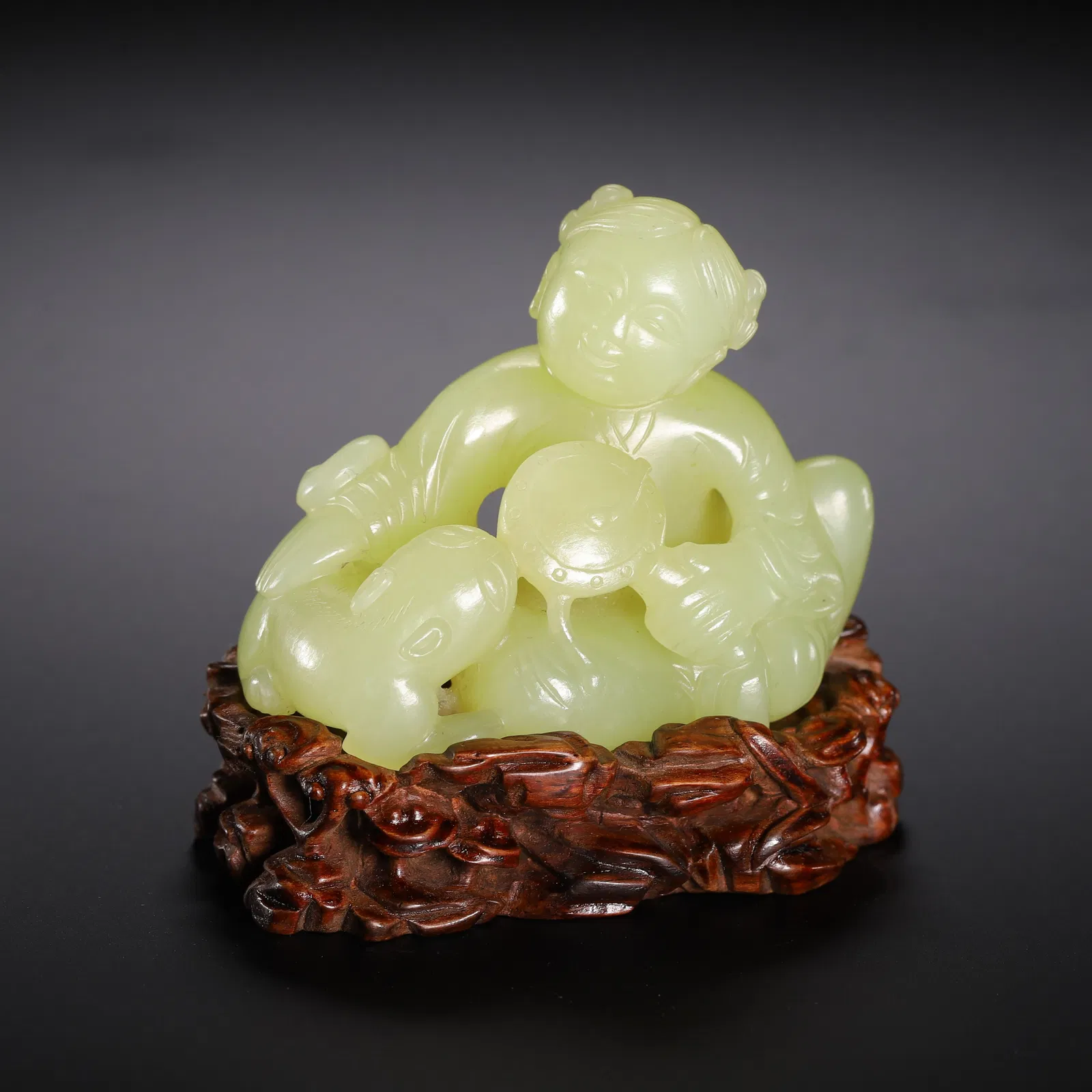 A CARVED YELLOW JADE BOY