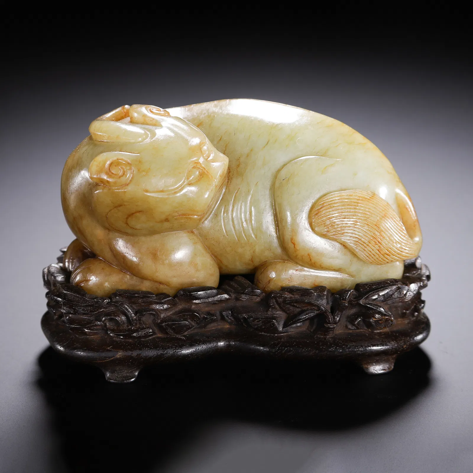 A CARVED YELLOW JADE MYTHICAL BEAST