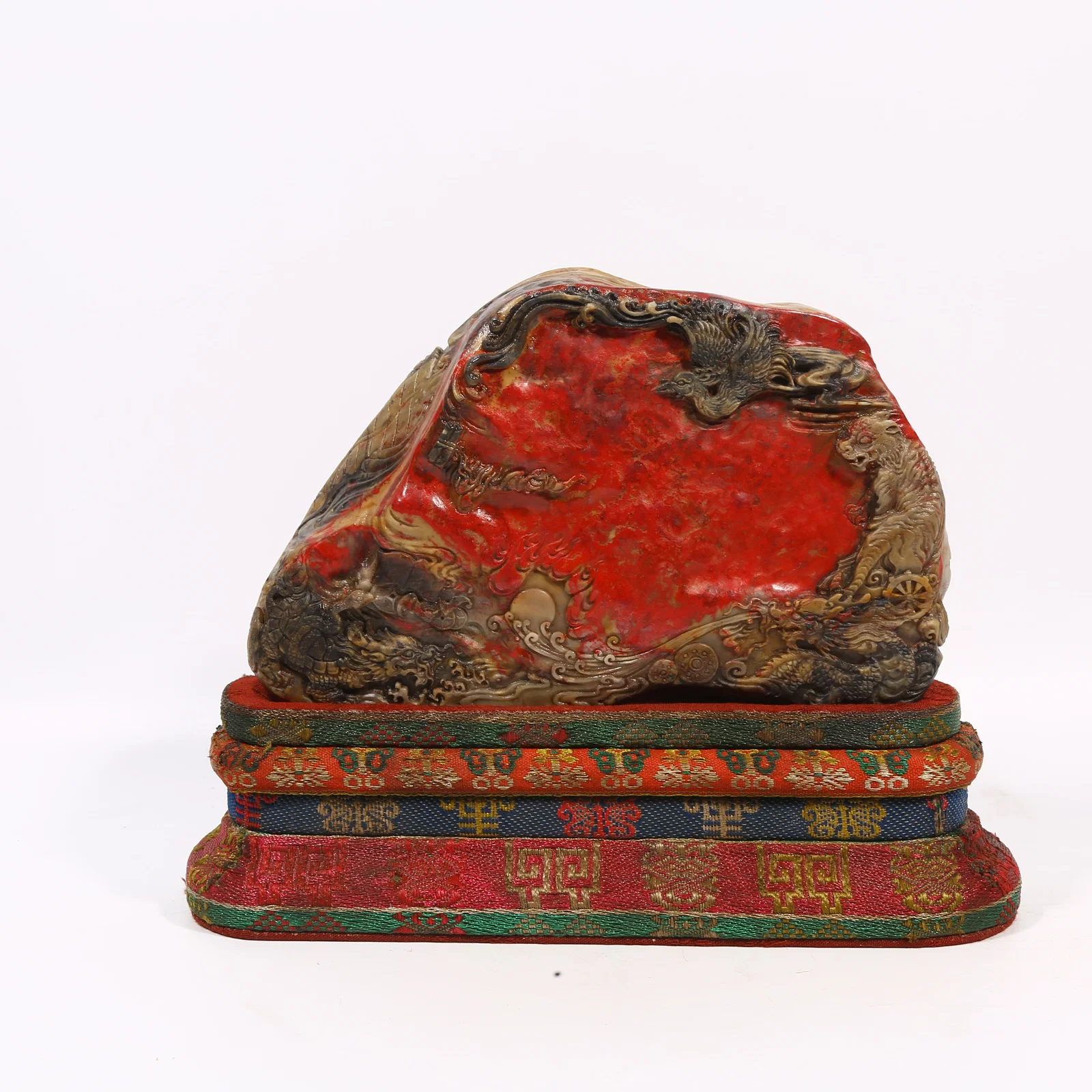 A CHANGHUA CHICKEN BLOOD STONE MINIATURE MOUNTAIN WITH FOUR SYMBOLS DESIGN