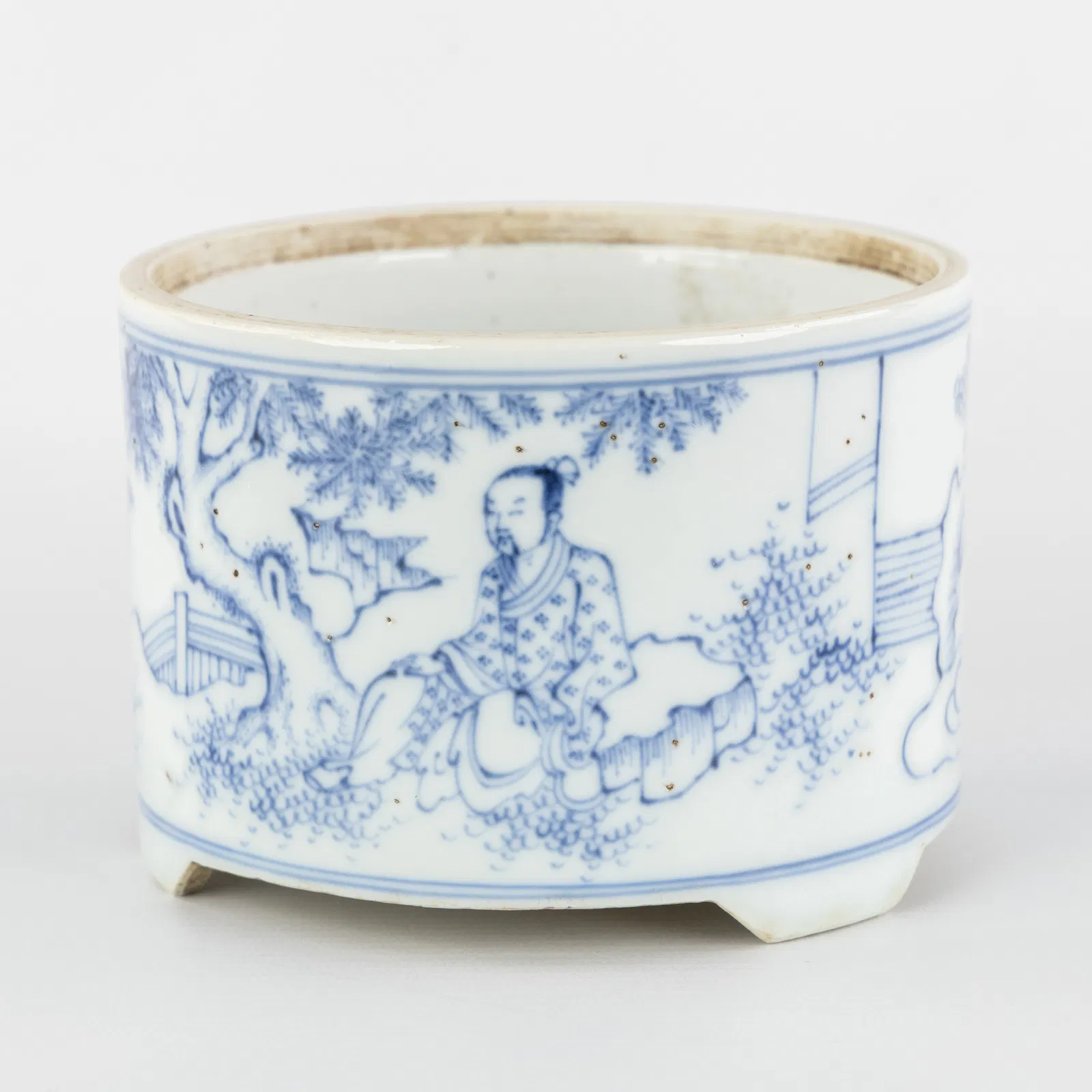 A Chinese Blue-and-White Brush pot, Tripod, decorated with 'Dignitary and Servant', Transitional