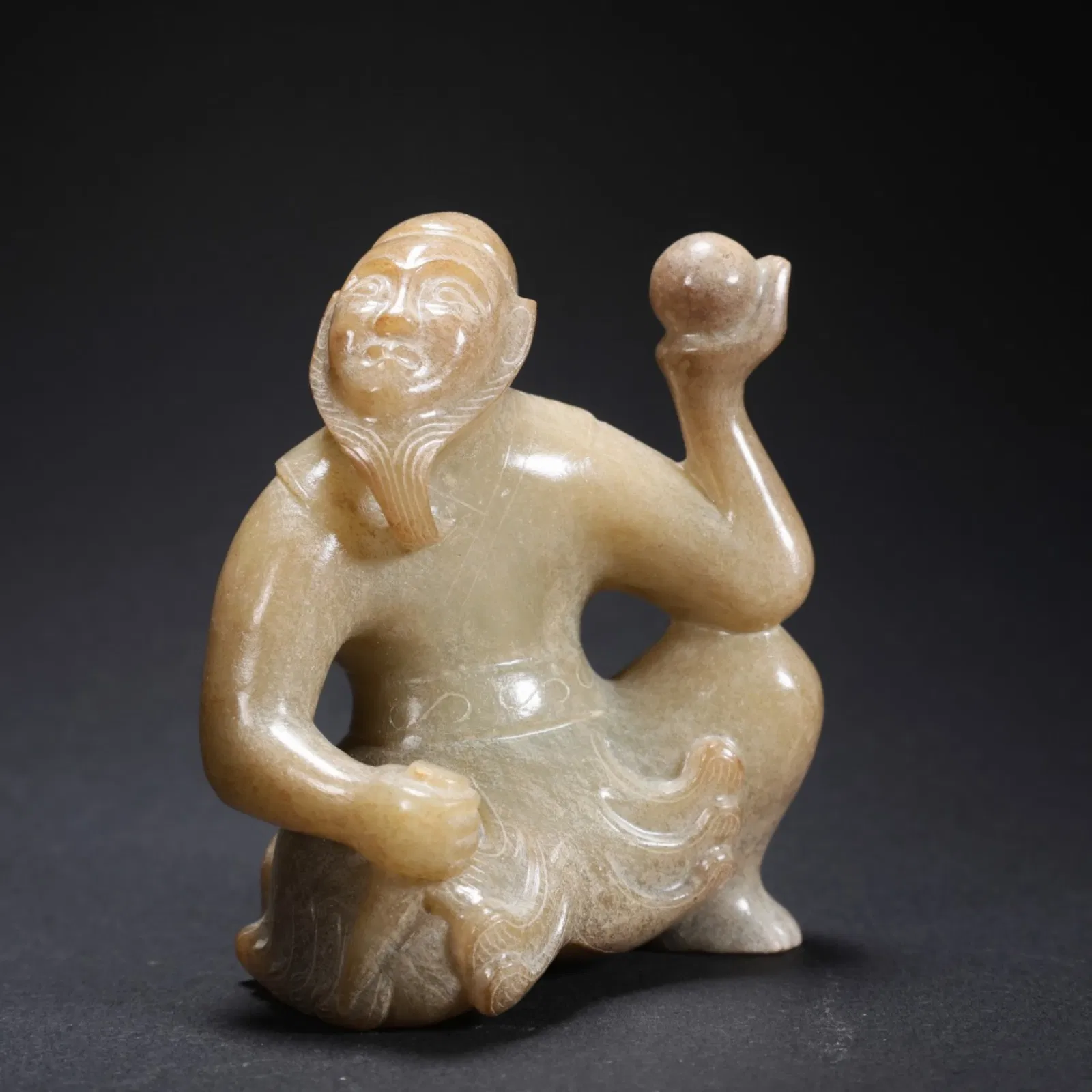 A Chinese Carved Jade Figure of Foreigner Ball Player