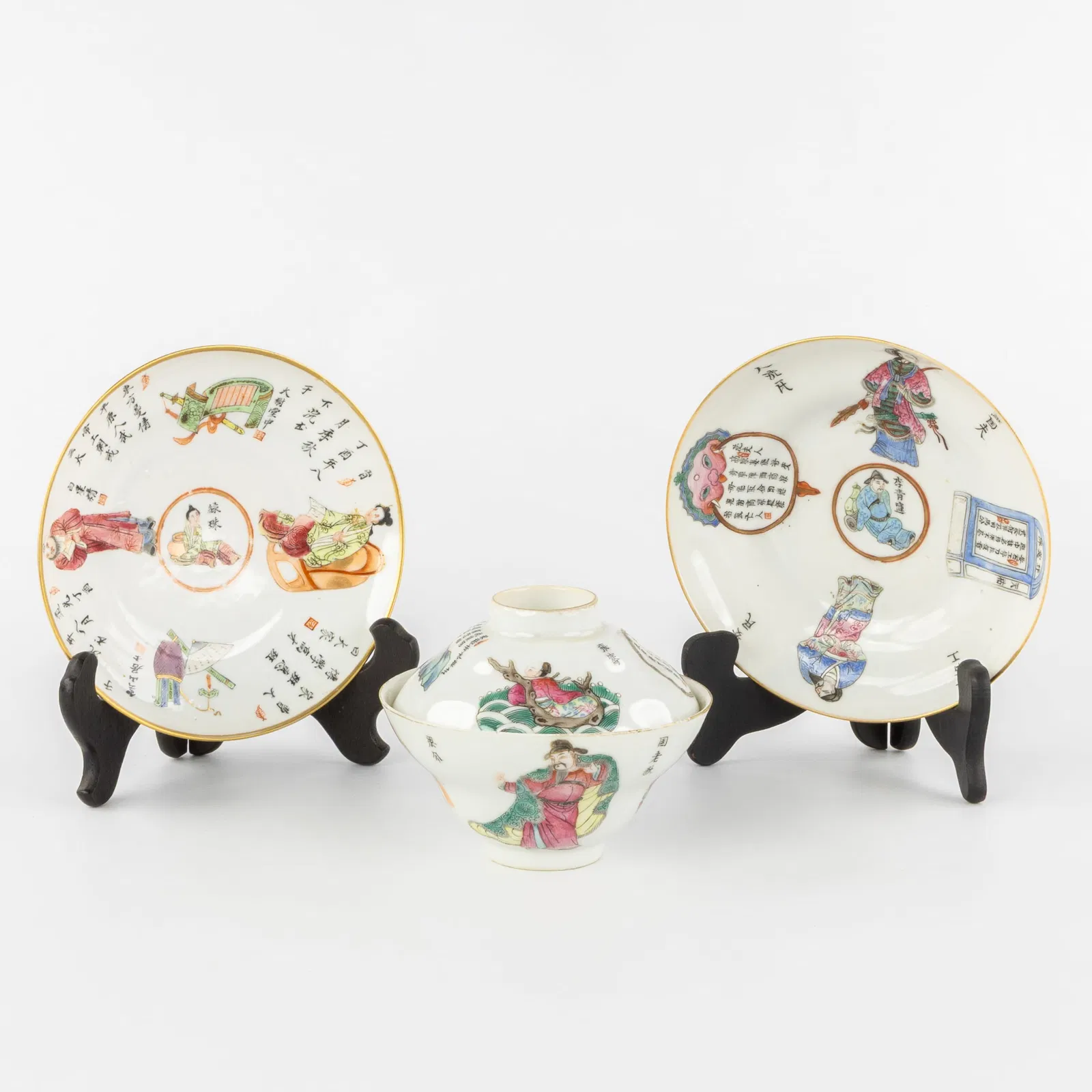 A Chinese famille rose 'Wu Shuang Pu' covered cup and two saucers, Daoguang marked and period.
